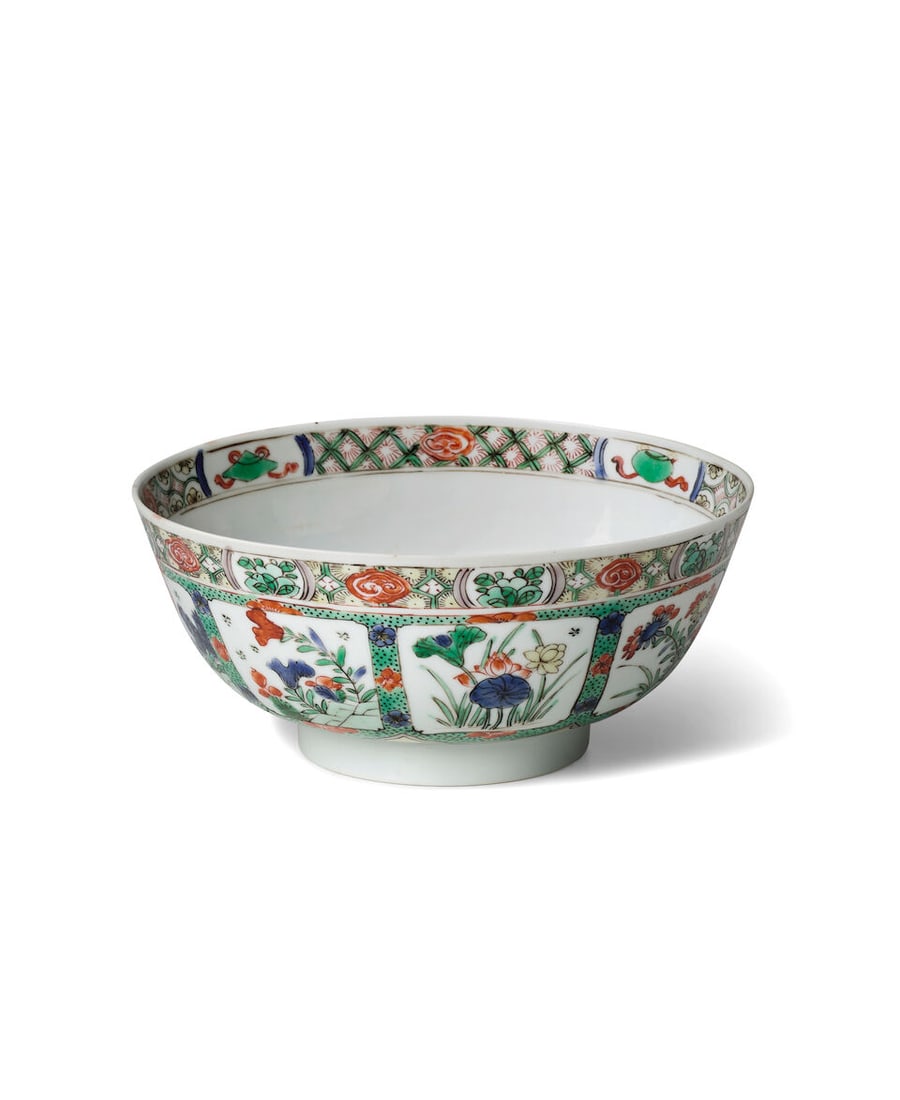 A FAMILLE VERTE 'FRUIT AND FLOWER' BOWL Kangxi, a studio cipher within double circle at base: A FAMILLE VERTE 'FRUIT AND FLOWER' BOWL Kangxi, a studio cipher within double circle at base 7 5/8in (19.4cm) diam; 3 1/4in (8.3cm) high Footnotes: 清康熙