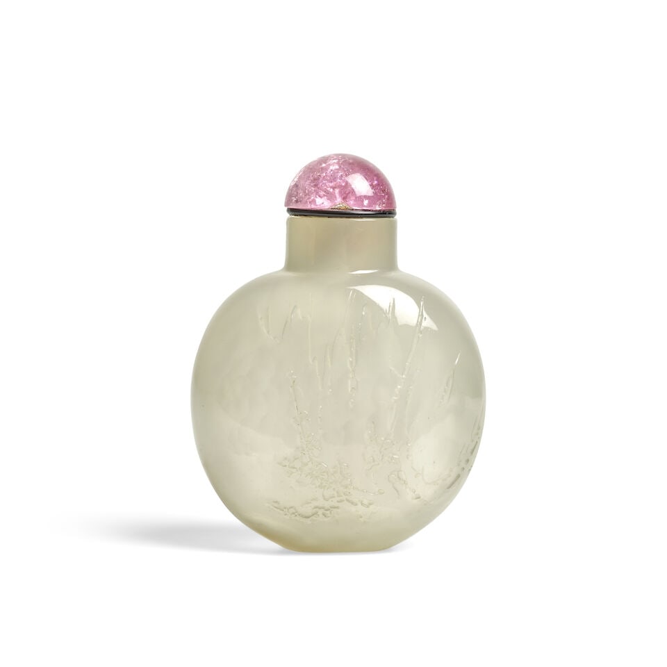 A LARGE, FINE, SUZHOUS BULBOUS SEMI-TRANSPARENT AGATE 'WINTER BLOSSOM AND ROCKWORK' SNUFF BOTTLE... (1 of 2)