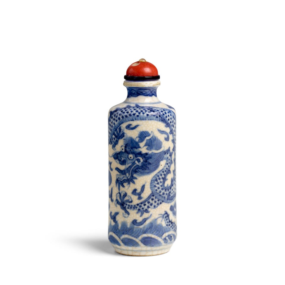 A CYLINDRICAL BLUE AND WHITE SOFT-PASTE PORCELAIN 'DRAGONS AND WAVES' SNUFF BOTTLE 1840-1920: A CYLINDRICAL BLUE AND WHITE SOFT-PASTE PORCELAIN 'DRAGONS AND WAVES' SNUFF BOTTLE 1840-1920 3in (7.5cm) high, stopper Footnotes: 1840-1920