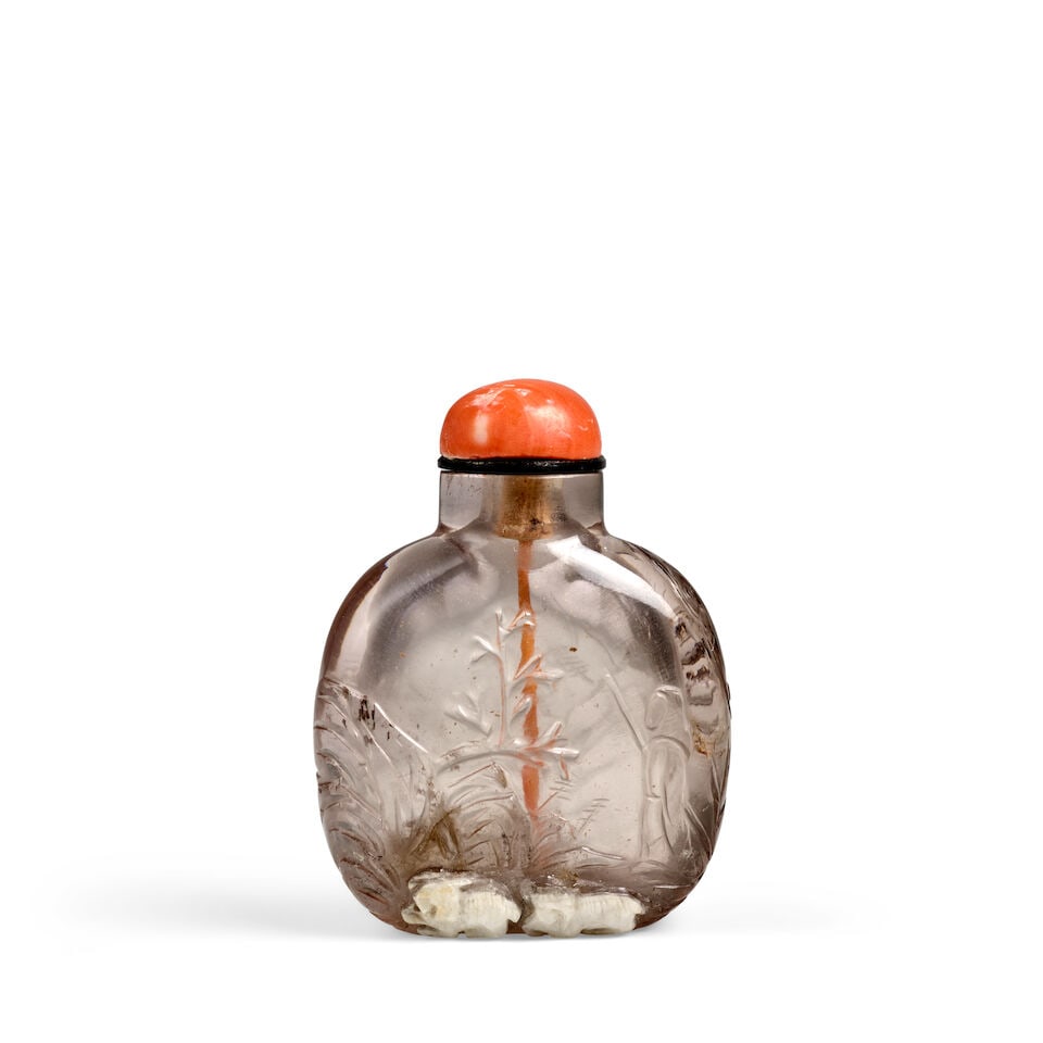 A SMALL, PALE SMOKY CRYSTAL 'GOATHERD AND TWO GOATS IN A WINTER LANDSCAPE' SNUFF BOTTLE 1820-1900: A SMALL, PALE SMOKY CRYSTAL 'GOATHERD AND TWO GOATS IN A WINTER LANDSCAPE' SNUFF BOTTLE 1820-1900 1 7/8in (4.7cm) high, stopper Footnotes: 1800-1900