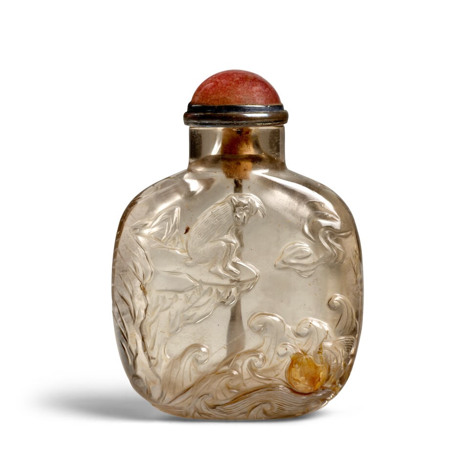 A LARGE, PALE SMOKY CRYSTAL 'MONKEY, SUN, WAVES AND PINE' SNUFF BOTTLE 1780-1880 (1 of 3)