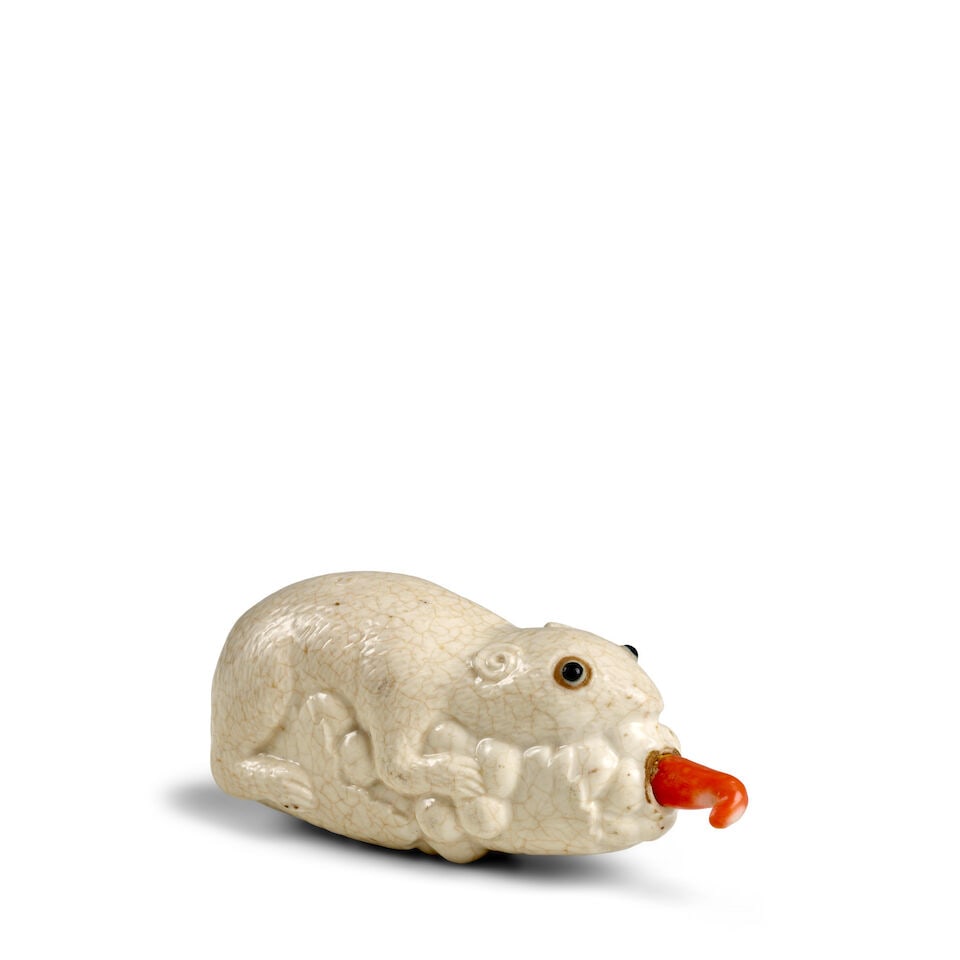 A CREAM-GLAZED SOFT-PASTE PORCELAIN 'SQUIRREL AND GRAPES' SNUFF BOTTLE 1830-1920 (1 of 3)