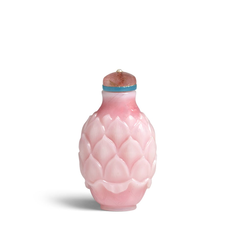 AN IMPERIAL OPAQUE PINK BLUSH AND WHITE GLASS OVERLAY 'LAYERED LOTUS PETAL' SNUFF BOTTLE 1740-1800: AN IMPERIAL OPAQUE PINK BLUSH AND WHITE GLASS OVERLAY 'LAYERED LOTUS PETAL' SNUFF BOTTLE 1740-1800 2 1/2in (6.3cm) high, stopper Footnotes: 1740-1800
