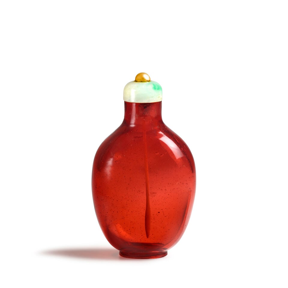 A SLIGHTLY BULBOUS, OVIFORM, TRANSPARENT RED GLASS SNUFF BOTLLE 1770-1860 (1 of 2)