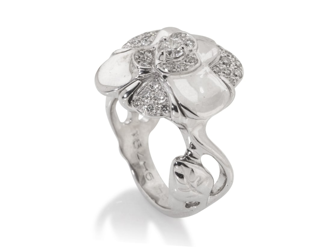 Chanel. Bague Camélia en or blanc 18 carats et diamants. Chanel. Camellia ring in 18-carat ...: Chanel. Bague Camélia en or blanc 18 carats et diamants. Chanel. Camellia ring in 18-carat white gold and diamonds. Condition grade: A +. Poids brut/gross weight : 9,57 gr. T 48.