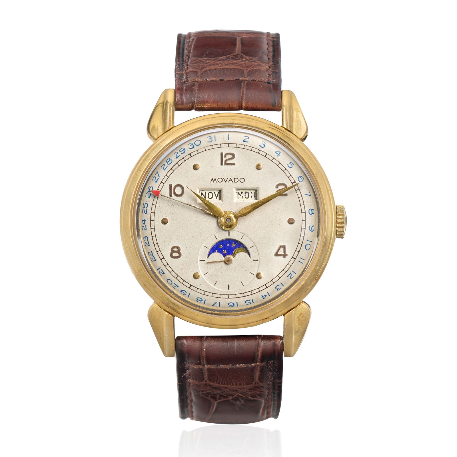 Movado. An 18K gold manual wind triple calendar wristwatch with moon phase Ref: 4823, Circa 1940: Movado. An 18K gold manual wind triple calendar wristwatch with moon phase Reference: 4823 Date: Circa 1940 Movement: 18-jewel Cal.473 manual wind Dial: Silvered, applied alternating gilt dot and Arab