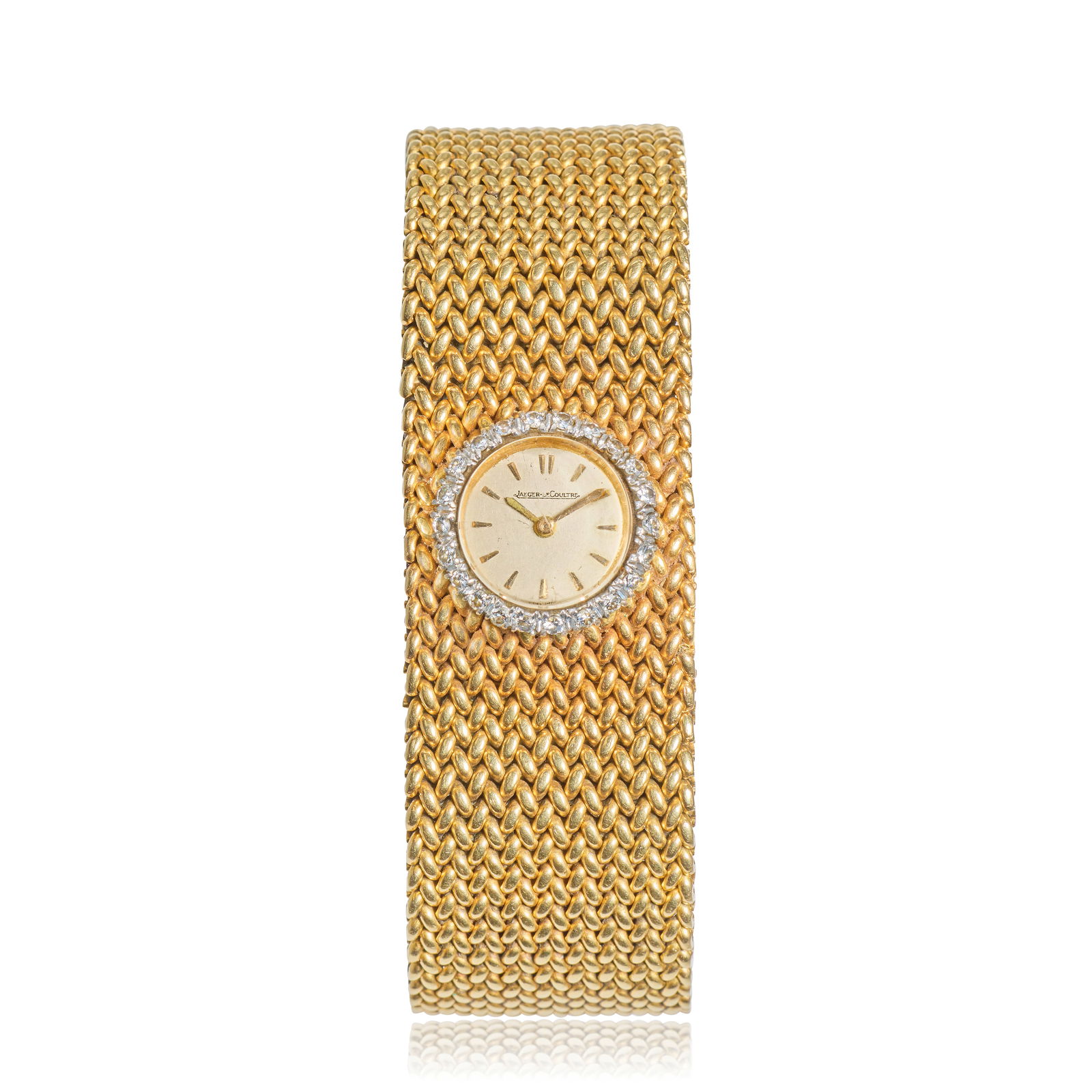 Jaeger-LeCoultre. A lady's 18K gold diamond set manual wind bracelet watch Circa 1961: Jaeger-LeCoultre. A lady's 18K gold diamond set manual wind bracelet watch Date: Circa 1961 Movement: Jewelled manual wind, No.1483723 Dial: Silvered, applied gilt dart hour markers, gilt pointed bato