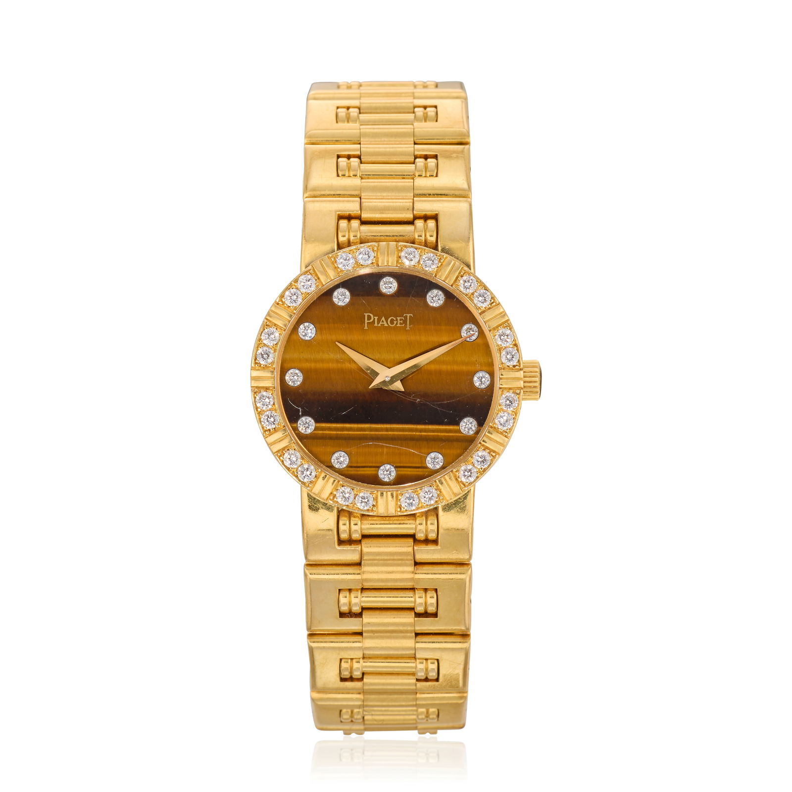 Piaget. A lady's 18K gold diamond set manual wind bracelet watch with Tiger's Eye dial Dancer, ...: Piaget. A lady's 18K gold diamond set manual wind bracelet watch with Tiger's Eye dial Model: Dancer Reference: 90564 K81 Date: Circa 1990 Movement: 18-jewel Cal.9P2 manual wind, adjusted to 5 positio