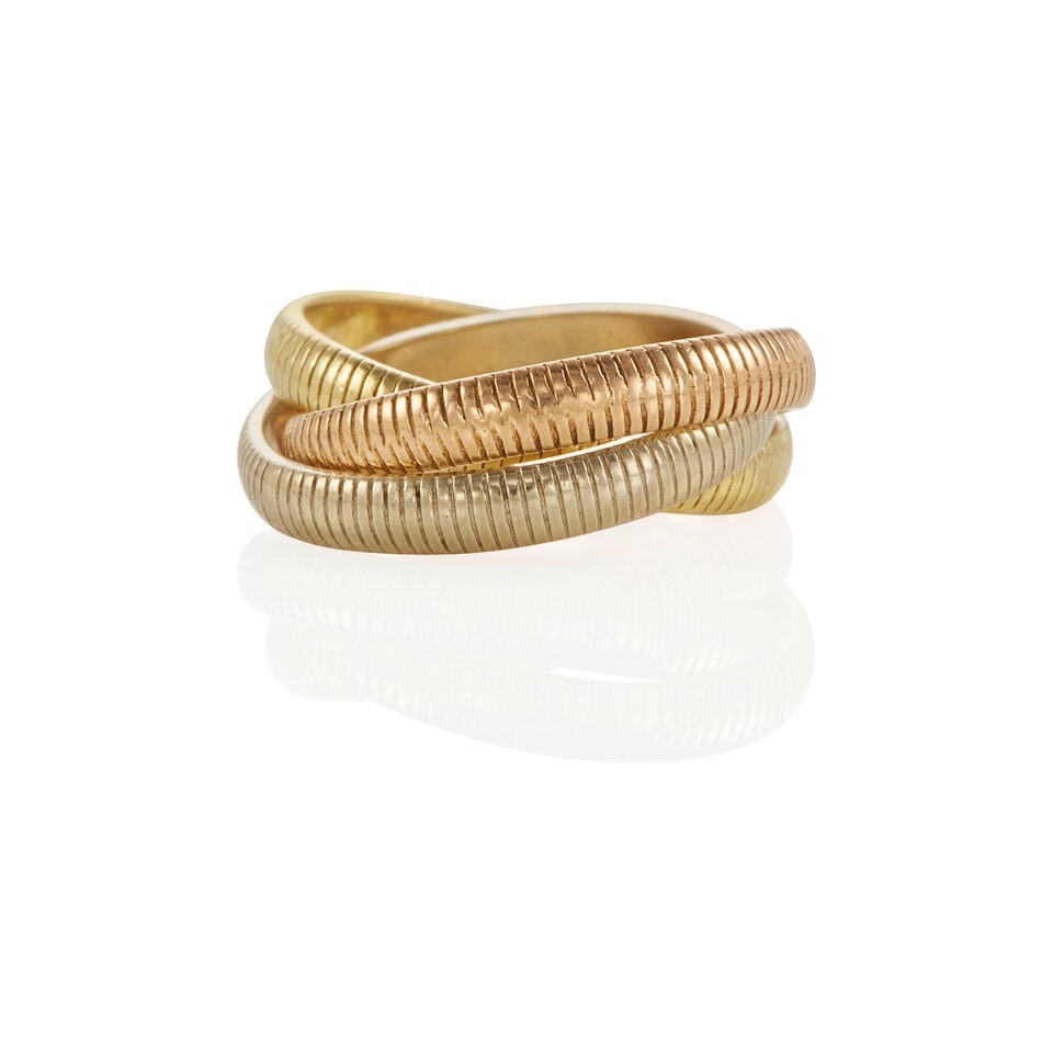 CARTIER: 18K TRICOLOR GOLD RIBBED TRINITY RING: CARTIER: 18K TRICOLOR GOLD RIBBED TRINITY RING • 18k yellow, white and rose gold • Signed Cartier • Size 2 1/4 • Estimated gross weight: 5.7 grams Footnotes: Overall condition,