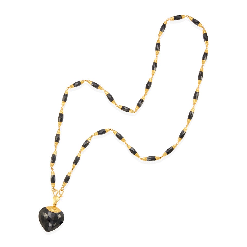 22K GOLD AND ONYX NECKLACE: 22K GOLD AND ONYX NECKLACE • 18k yellow gold • 1 faceted onyx drop pendant 25.7 x 26.00 x 14.68mm • Numerous faceted onyx accents 8.61 x 5.42mm • Length 26 1/4 in. •