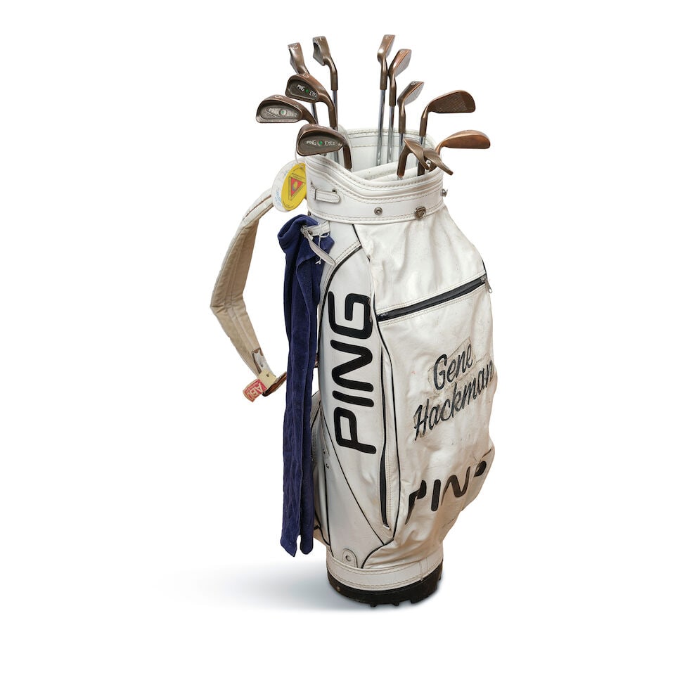 Gene Hackman: A Personalized Golf Bag and Clubs: Gene Hackman: A Personalized Golf Bag and Clubs Comprising a Ping golf bag inscribed Gene / Hackman, twelve golf clubs, five tags from various golf courses and tournaments, and a towel. height of