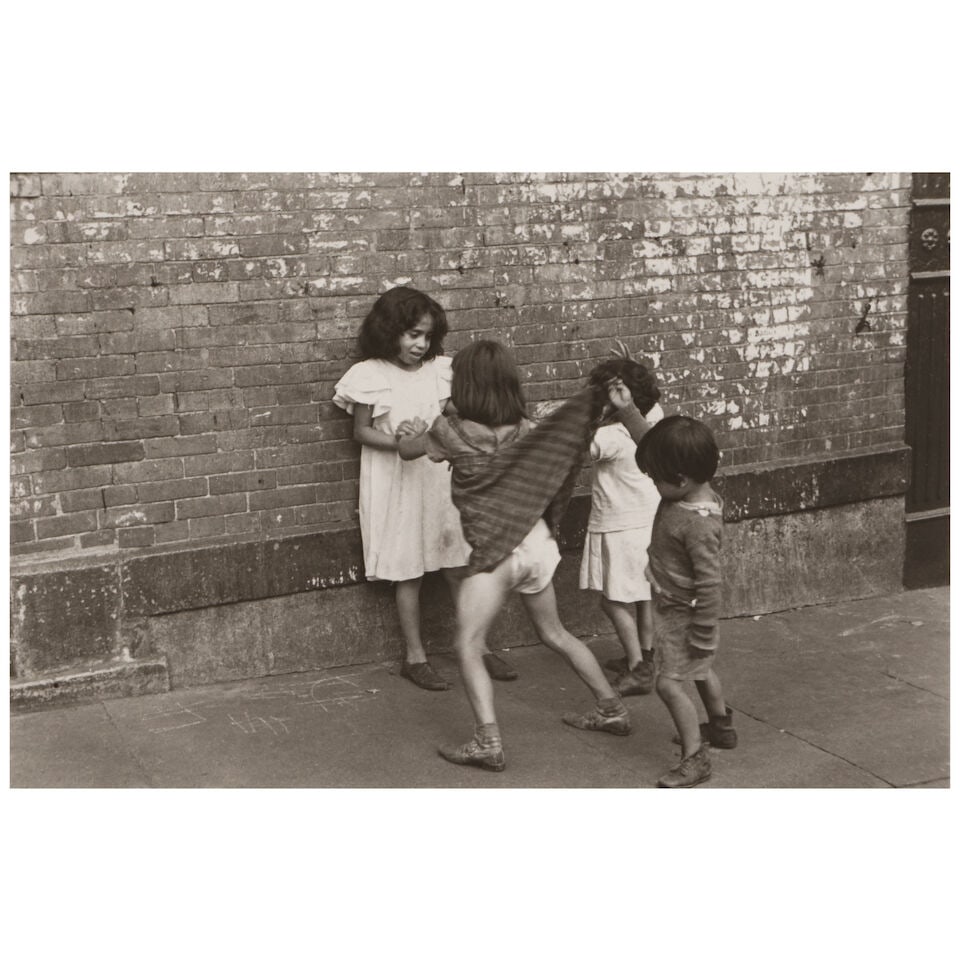 Helen Levitt (1913-2009); New York (Boy Lifting Skirt);: Helen Levitt (1913-2009) New York (Boy Lifting Skirt), 1942 Gelatin silver print, printed later; signed, dated, and annotated 'n.y.' in pencil on the reverse. 6 1/8 x 9 1/4 in. (15.6 x 23.5 cm.) sheet