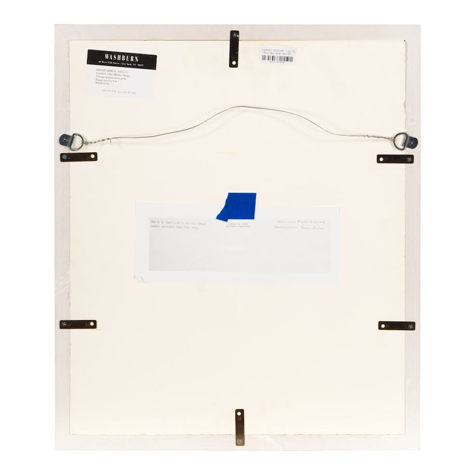 Diane Arbus (1923-1971); Pin-up collection at a barber shop, N.Y.C.; - 5