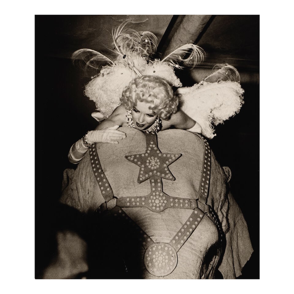 Weegee (Arthur Fellig) (1899-1968); Marilyn Monroe on a Pink Elephant (Opening Night of the Ring...: Weegee (Arthur Fellig) (1899-1968) Marilyn Monroe on a Pink Elephant (Opening Night of the Ringling Brothers and Barnum & Bailey Circus), 1955 Gelatin silver print, printed later; the