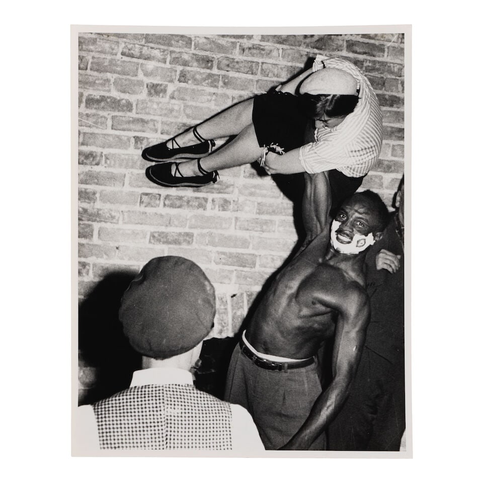 Weegee (Arthur Fellig) (1899-1968); Untitled (Man Lifting Woman with One Hand); - 2