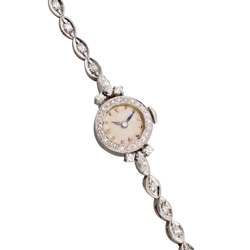 Mathey-Tissot. A lady's platinum and diamond set manual wind bracelet watch Circa 1930: Mathey-Tissot. A lady's platinum and diamond set manual wind bracelet watch Date: Circa 1930 Movement: 17-jewel manual wind Dial: Silvered Case: Brushed and polished round, diamond set