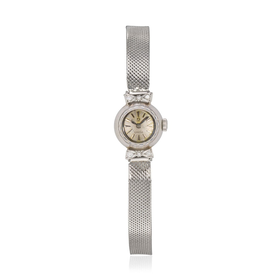 Omega. A lady's 18K white gold diamond set manual wind bracelet watch Saphette, Circa 1965: Omega. A lady's 18K white gold diamond set manual wind bracelet watch Model: Saphette Date: Circa 1965 Movement: 17-jewel Cal.580 manual wind, No.17169371 Dial: Silvered Case: Brushed and polished rou