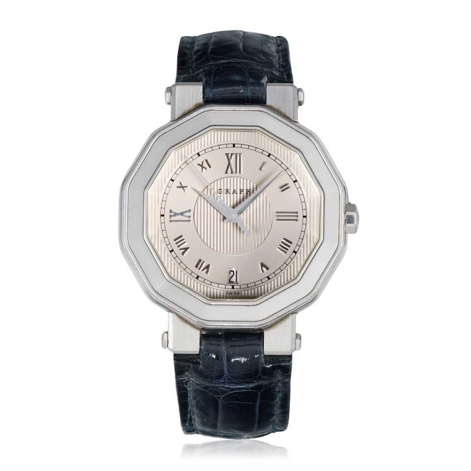 Graff. An 18K white gold quartz calendar wristwatch Ref: GXXVI, Circa 2005: Graff. An 18K white gold quartz calendar wristwatch Reference: GXXVI Date: Circa 2005 Movement: Jewelled ETA Cal.955.412 quartz Dial: Silvered Case: Brushed and polished dodecagonal form,