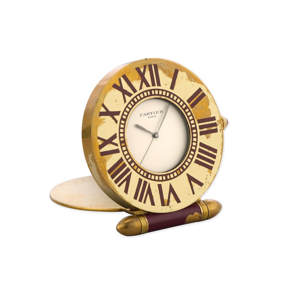 Cartier. A gilt and enamel quartz travel clock with alarm Circa 1980 (1 of 2)