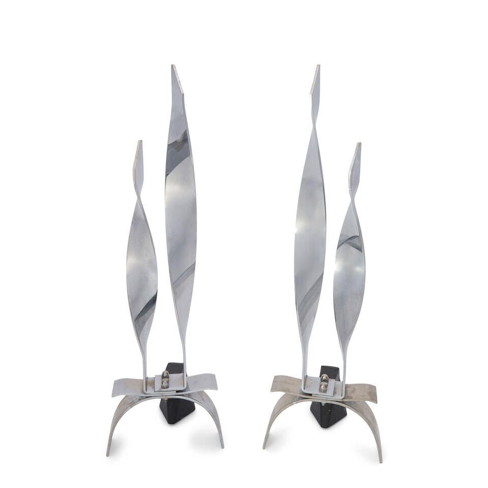 MODERNIST Pair of Flame-Form Andirons1960spolished chrome and cast iron, unmarkedheight 25 1/2; ... (1 of 2)