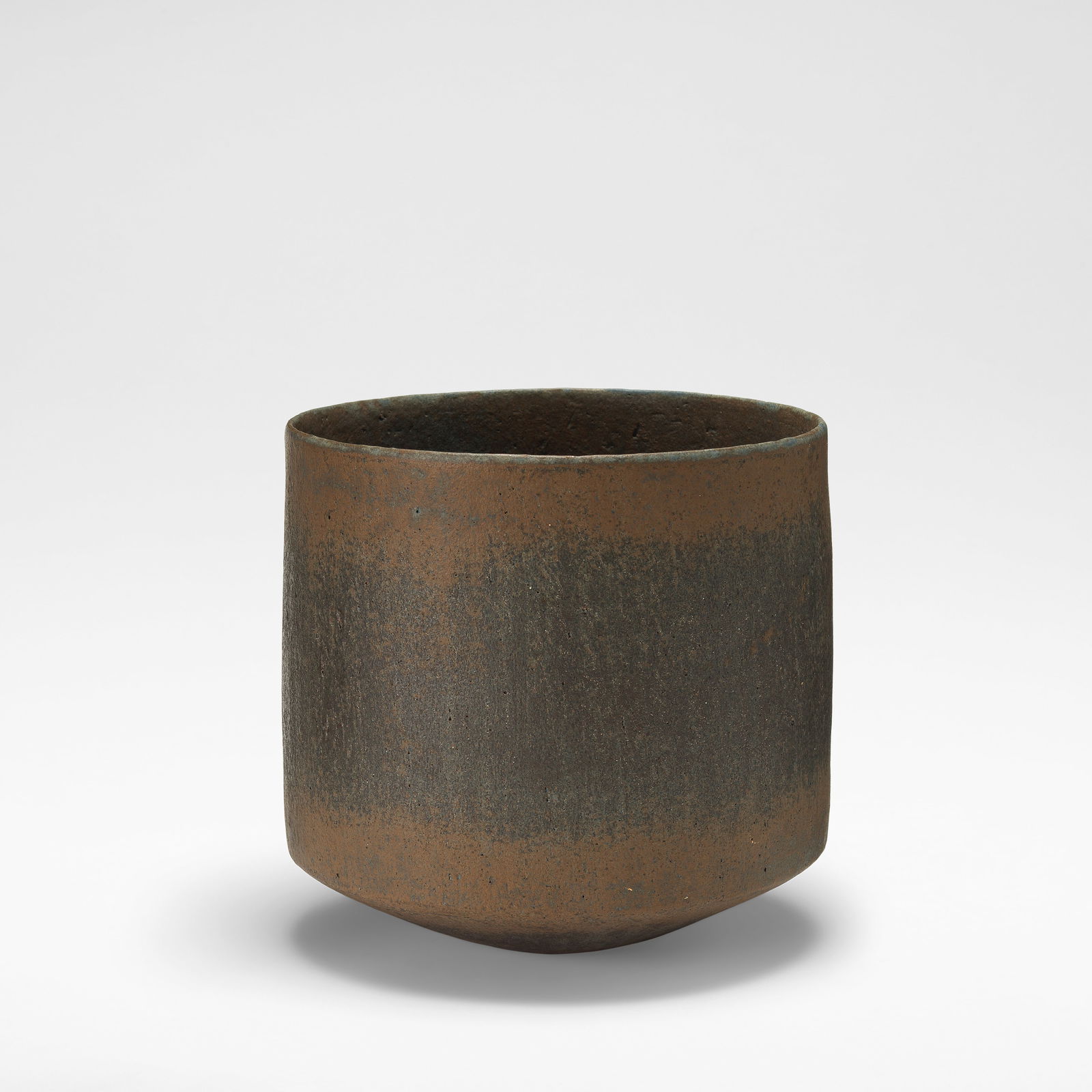 John Ward High-sided bowl, circa 1991: John Ward High-sided bowl, circa 1991 Stoneware, mottled black and brown glazes over a textured body. 18.5 cm high, 18.5 cm diameter Underside impressed with artist's mark. Footnotes: Literature Emma