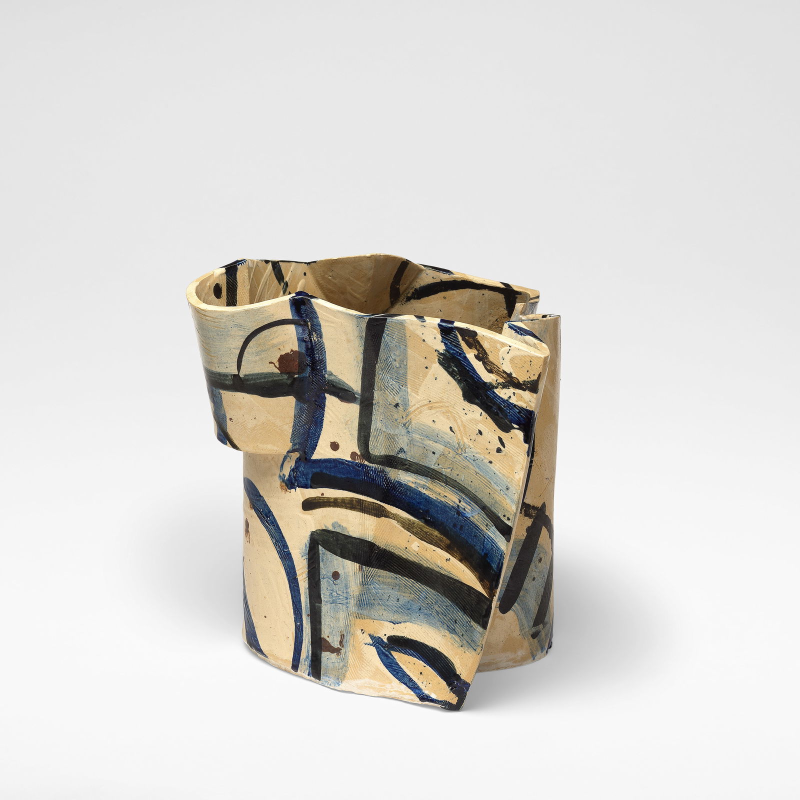 Alison Britton Abstract vessel, 1987: Alison Britton Abstract vessel, 1987 Earthenware, slab built, of abstract form with flared undulating rim, decorated in ochre glaze, painted abstract designs in shades of brown and black. 30.5 cm high