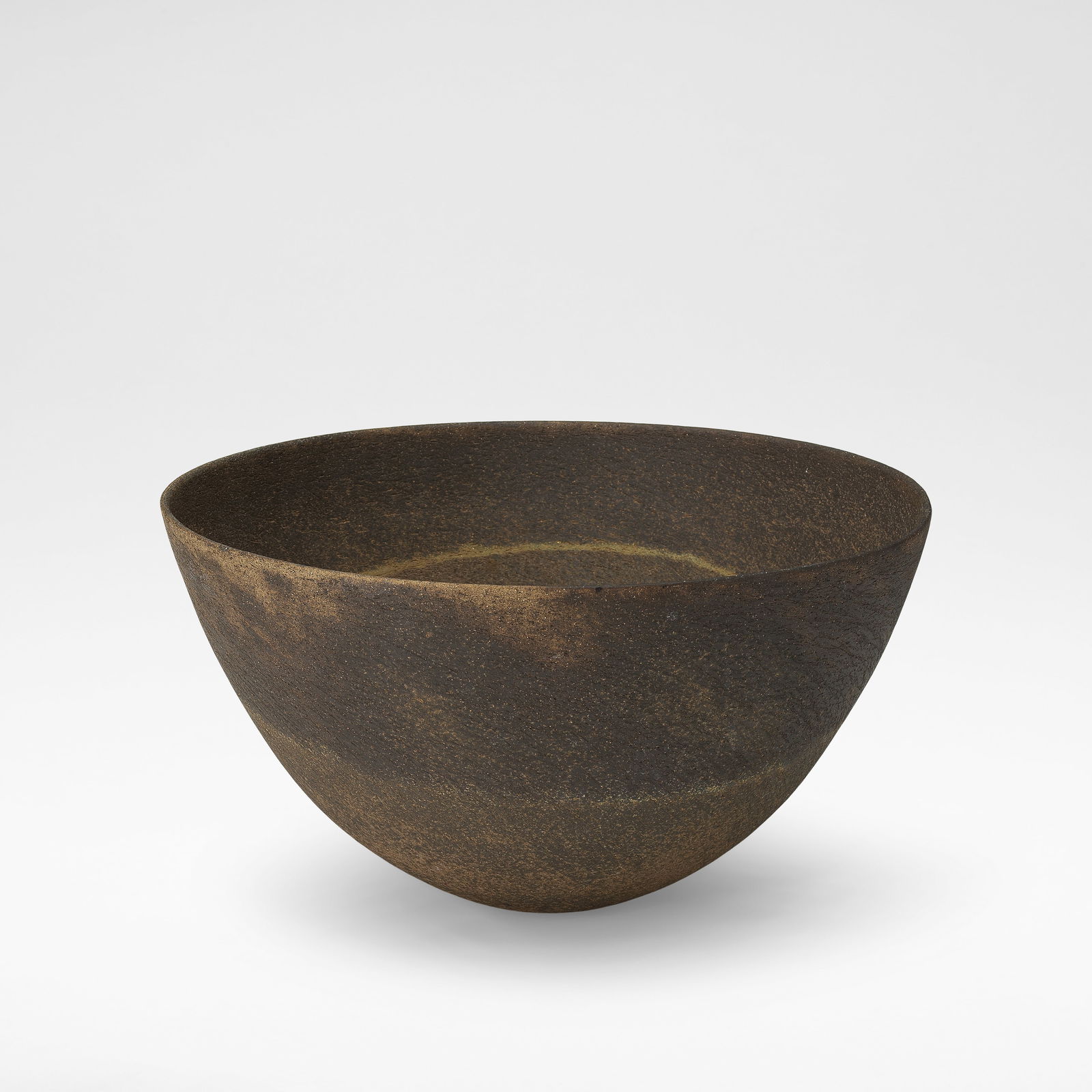 Jennifer Lee Large bowl, circa 1980s: Jennifer Lee Large bowl, circa 1980s Stoneware, textured and mottled brown body with single integral olive band and a fine cream speckle. 20 cm high, 36 cm diameter Footnotes: Footnote Bonhams wishes