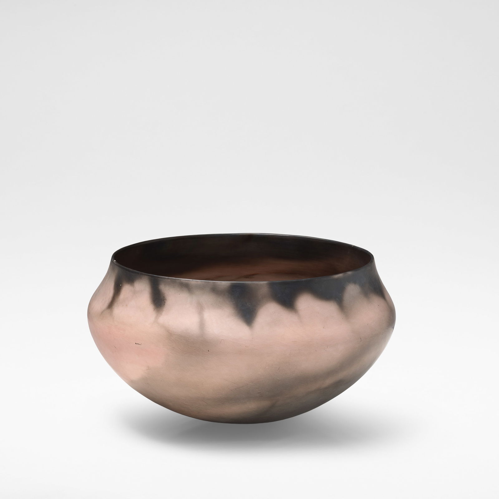 Gabriele Koch Large pot, circa 1990: Gabriele Koch Large pot, circa 1990 Earthenware, burnished and smoke fired in shades of pink and black. 24 cm high, 43 cm diameter With incised signature to the base. This lot is subject to the follow