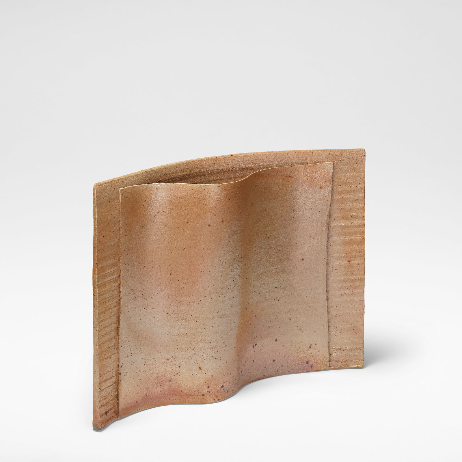 Joanna Constantinidis Pot with folded front, circa 1987: Joanna Constantinidis Pot with folded front, circa 1987 Porcelain, mottled dry pale brown and lustrous silver glazes with a soft iron speckle, with ribbed back panel and attached folded front panel. 3