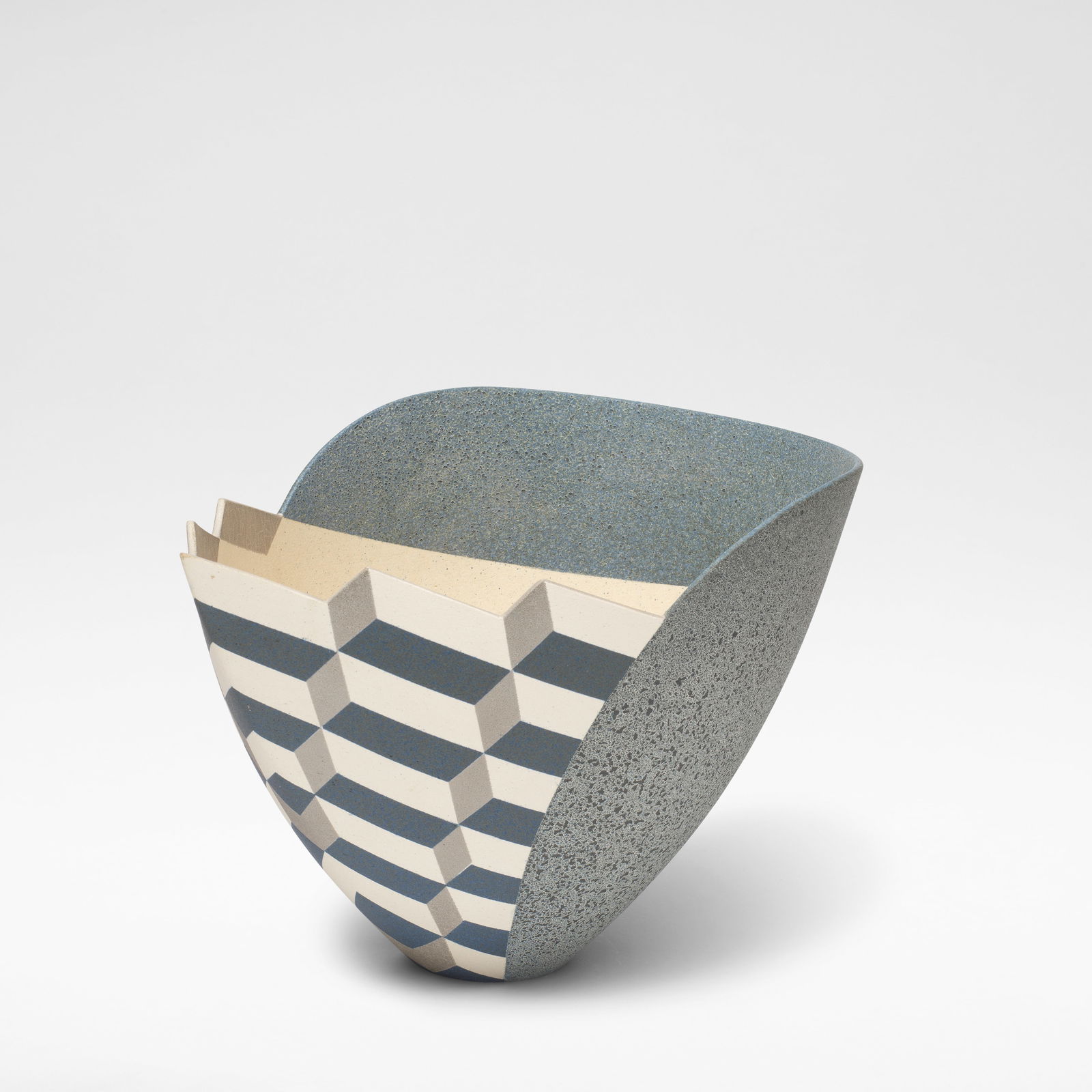 Jon Middlemiss 'Optical Cube Vessel Form', circa 1996: Jon Middlemiss 'Optical Cube Vessel Form', circa 1996 Stoneware, geometric cube design of contrasting navy, cream and grey glazes, with a mottled blue glaze to the other side, and a speckled cream gla