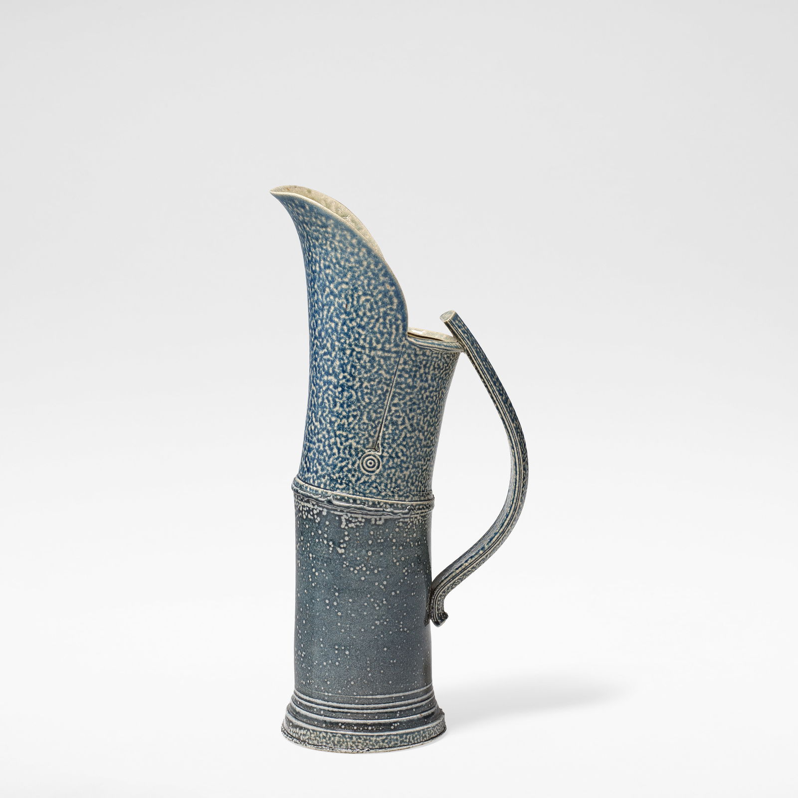 Walter Keeler 'Articulated Jug', circa 1990: Walter Keeler 'Articulated Jug', circa 1990 Stoneware, blue salt glaze with running olive green salt glaze to interior, with an extended spout and strap handle. 45.5 cm high, 21 cm wide, 14 cm deep Im