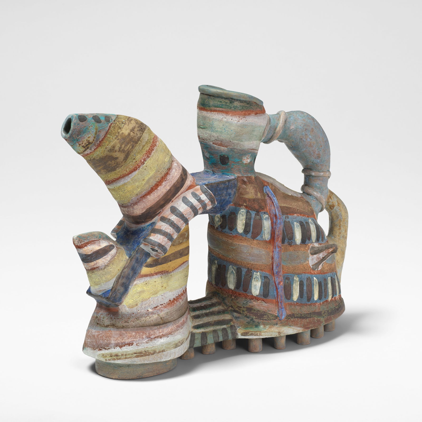 Angus Suttie 'Fantasy' teapot, circa 1986: Angus Suttie 'Fantasy' teapot, circa 1986 Earthenware, painted in vivid polychrome glazes with abstract designs, modelled as a shoe to the base. 29 cm high, 36.5 cm wide, 13.5 cm deep Underside painte
