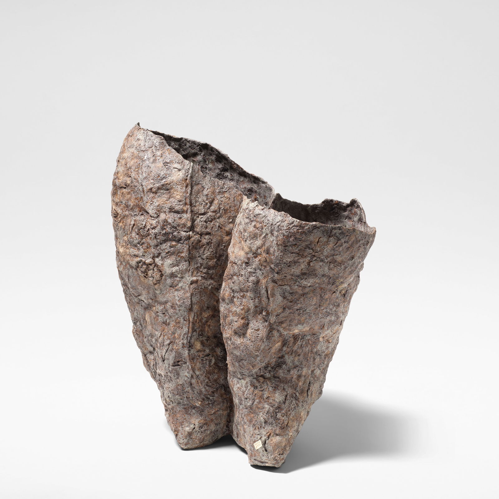 Sara Radstone 'Double Vessel', 1988: Sara Radstone 'Double Vessel', 1988 Stoneware, mottled purple and ochre glazes over a heavily textured ground. 47 cm high, 41 cm wide, 24 cm deep Incised to the base SR88. This lot is subject to the f