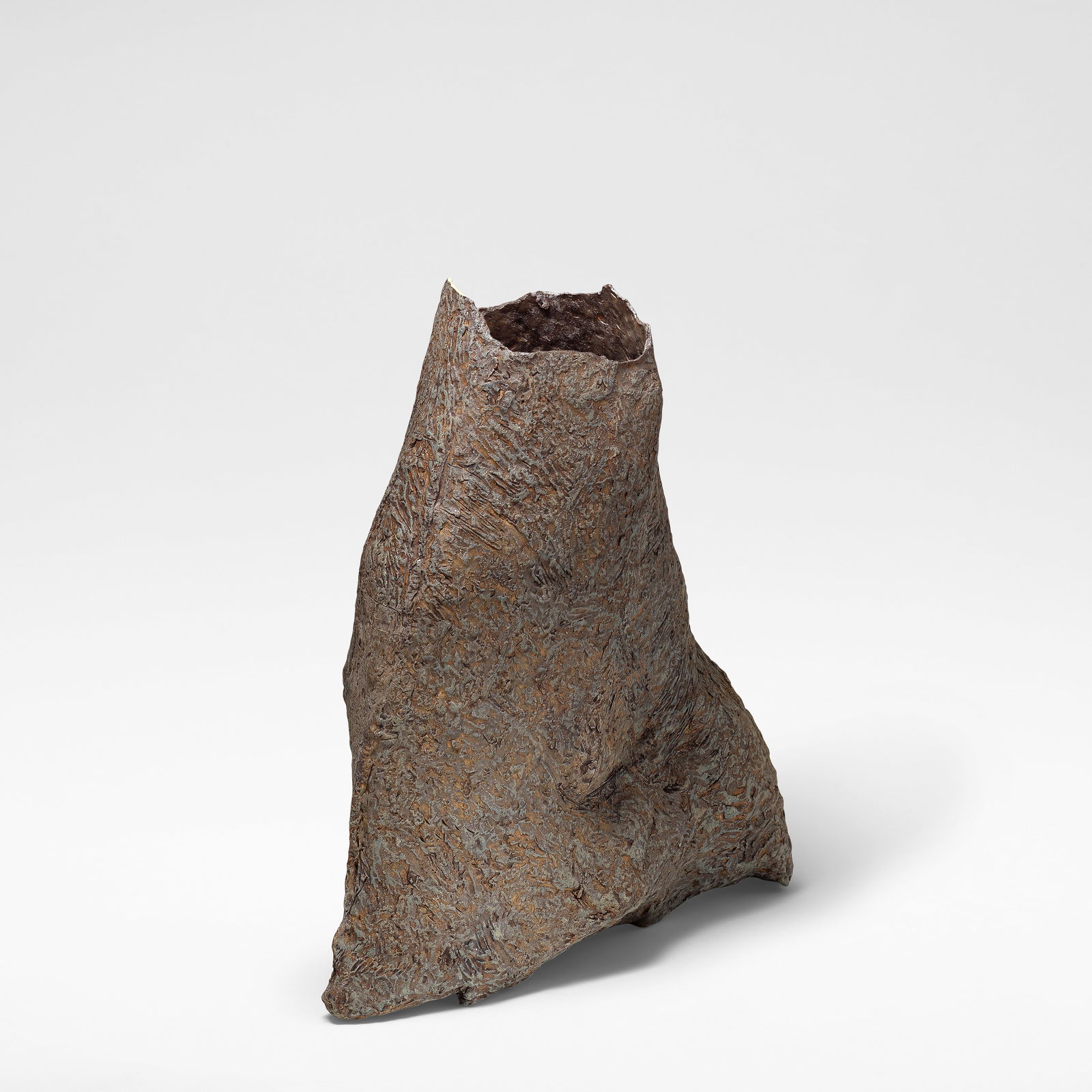 Sara Radstone Sack form, circa 1988: Sara Radstone Sack form, circa 1988 Stoneware, mottled purple, brown, grey and blue glaze over a textured ground. 55 cm high, 55 cm wide, 18 cm high This lot is subject to the following lot symbols: &