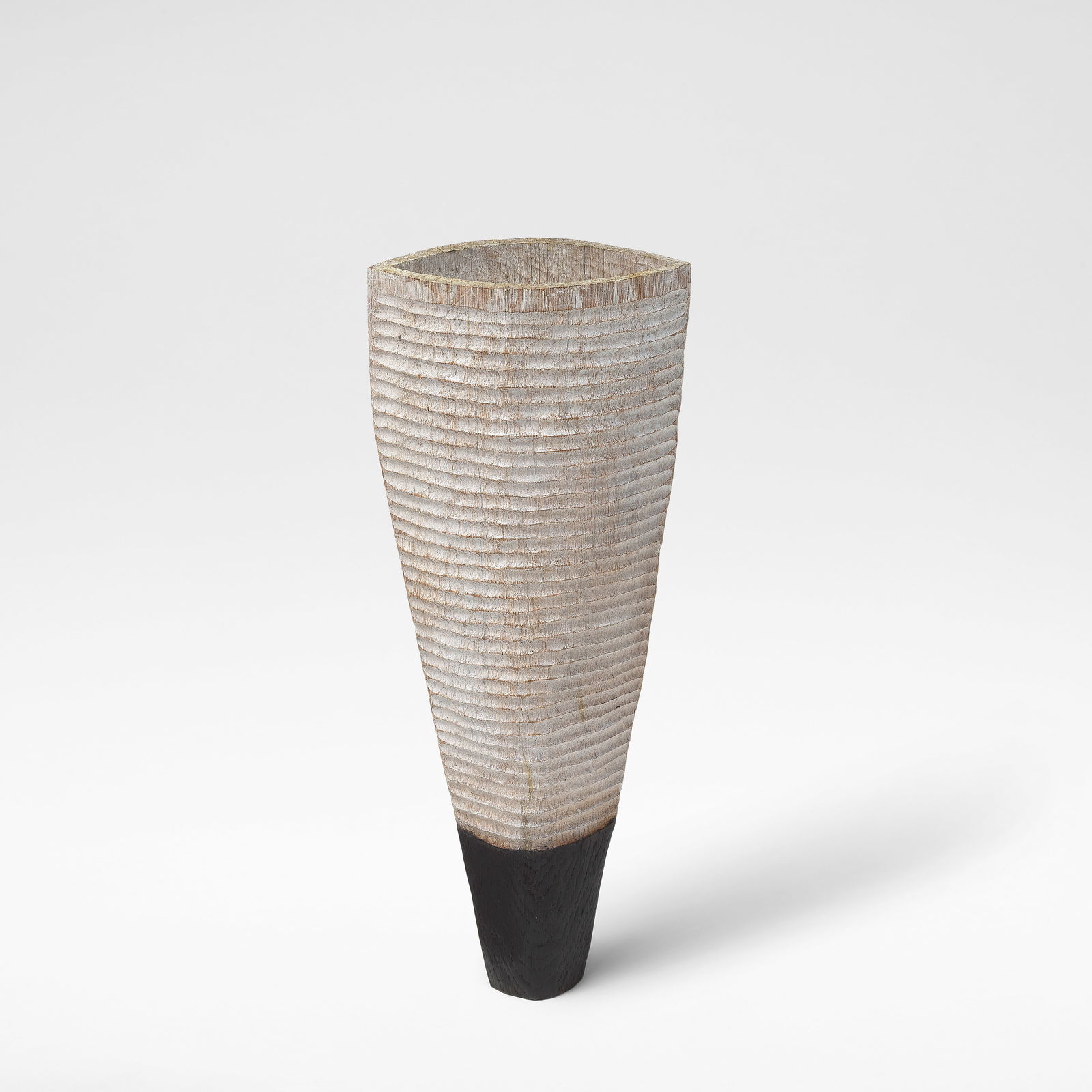 Malcolm Martin and Gaynor Dowling 'Striped Vessel': Malcolm Martin and Gaynor Dowling 'Striped Vessel' Limed and scorched oak, with carved ribbing to the limed body and a shallow opening to top. 38 cm high, 15.5 cm wide, 7.5 cm deep This lot is subject