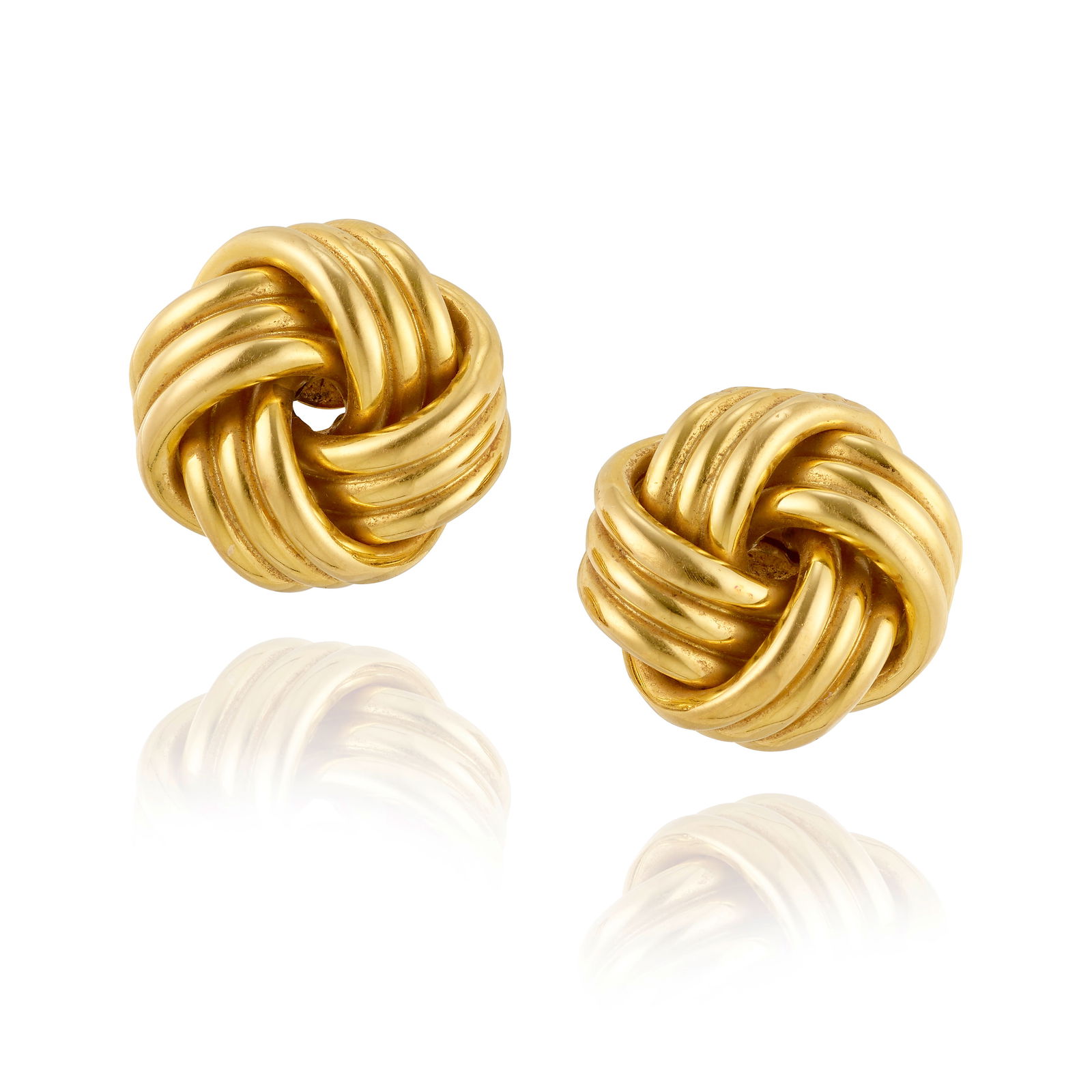 TIFFANY & CO.: A PAIR OF 18K GOLD EARCLIPS, 1995: TIFFANY & CO.: A PAIR OF 18K GOLD EARCLIPS, 1995Each of knot design; signed Tiffany & Co.; 1995; length 1 in.Footnotes:OVERALL CONDITION: Metal stamped and tested with XRF (X-ray fluorescence) for
