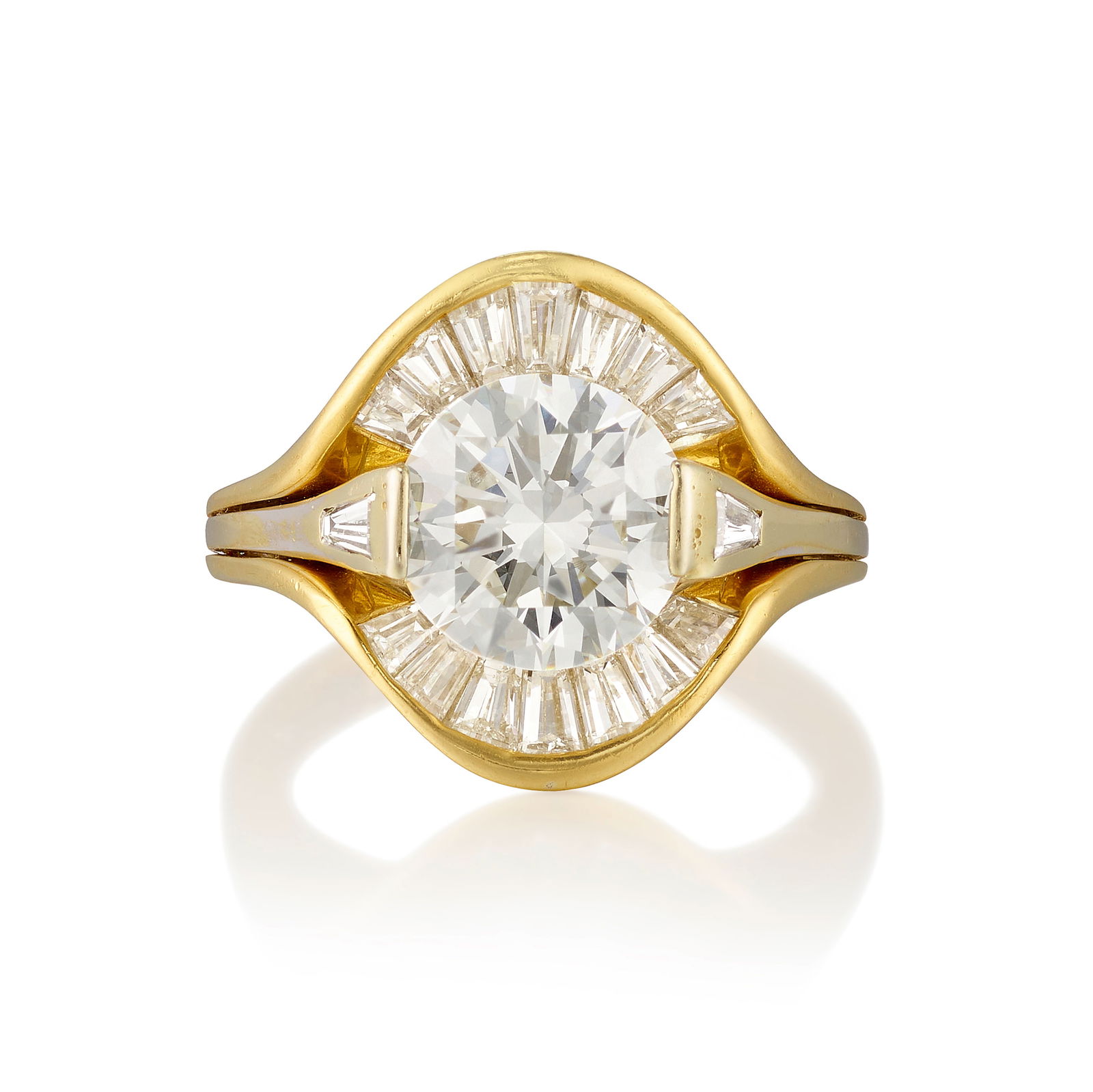 A DIAMOND RING: A DIAMOND RINGCentering a round brilliant-cut diamond, flanked by tapered-baguette diamonds, within a tapered-baguette diamond-set jacket; estimated center diamond weight 2.40 carats; estimated