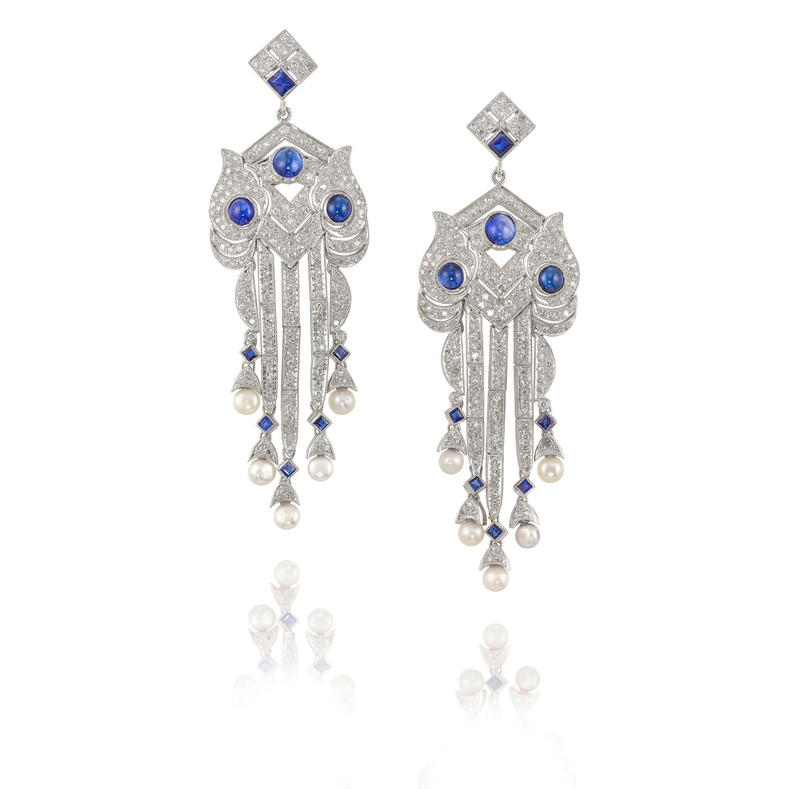 A PAIR OF 18K WHITE GOLD, SAPPHIRE AND DIAMOND EARRINGS: A PAIR OF 18K WHITE GOLD, SAPPHIRE AND DIAMOND EARRINGS Of ornate design, comprising round cabochon and square, step-cut sapphires, accented with round brilliant and single-cut diamonds, suspending bu