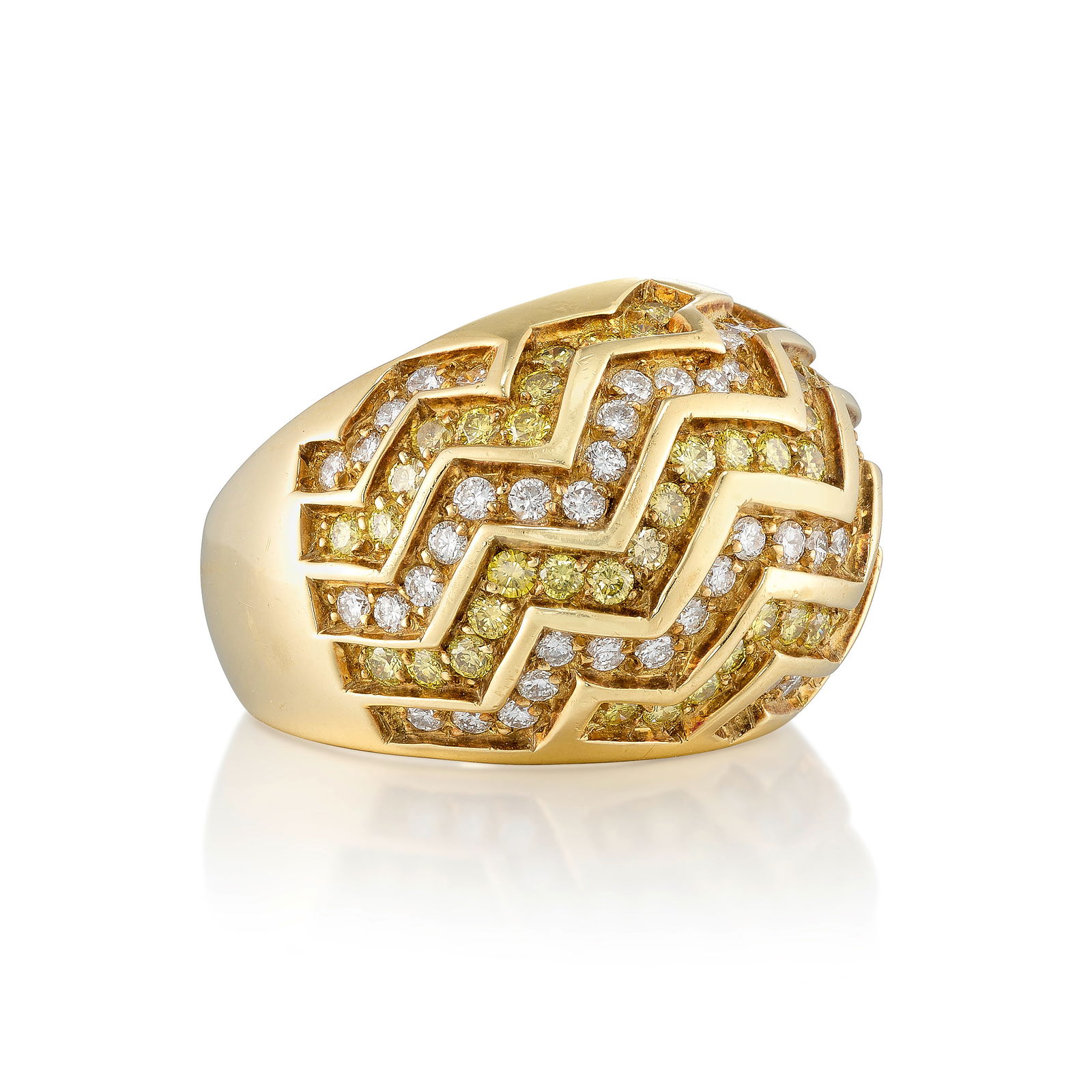 CARTIER: AN 18K GOLD, COLORED DIAMOND AND DIAMOND RING: CARTIER: AN 18K GOLD, COLORED DIAMOND AND DIAMOND RINGOf chevron pattern, set with round brilliant-cut diamonds; signed Cartier; no. 626123; 1989; estimated total diamond weight 2.00 carats; size 7