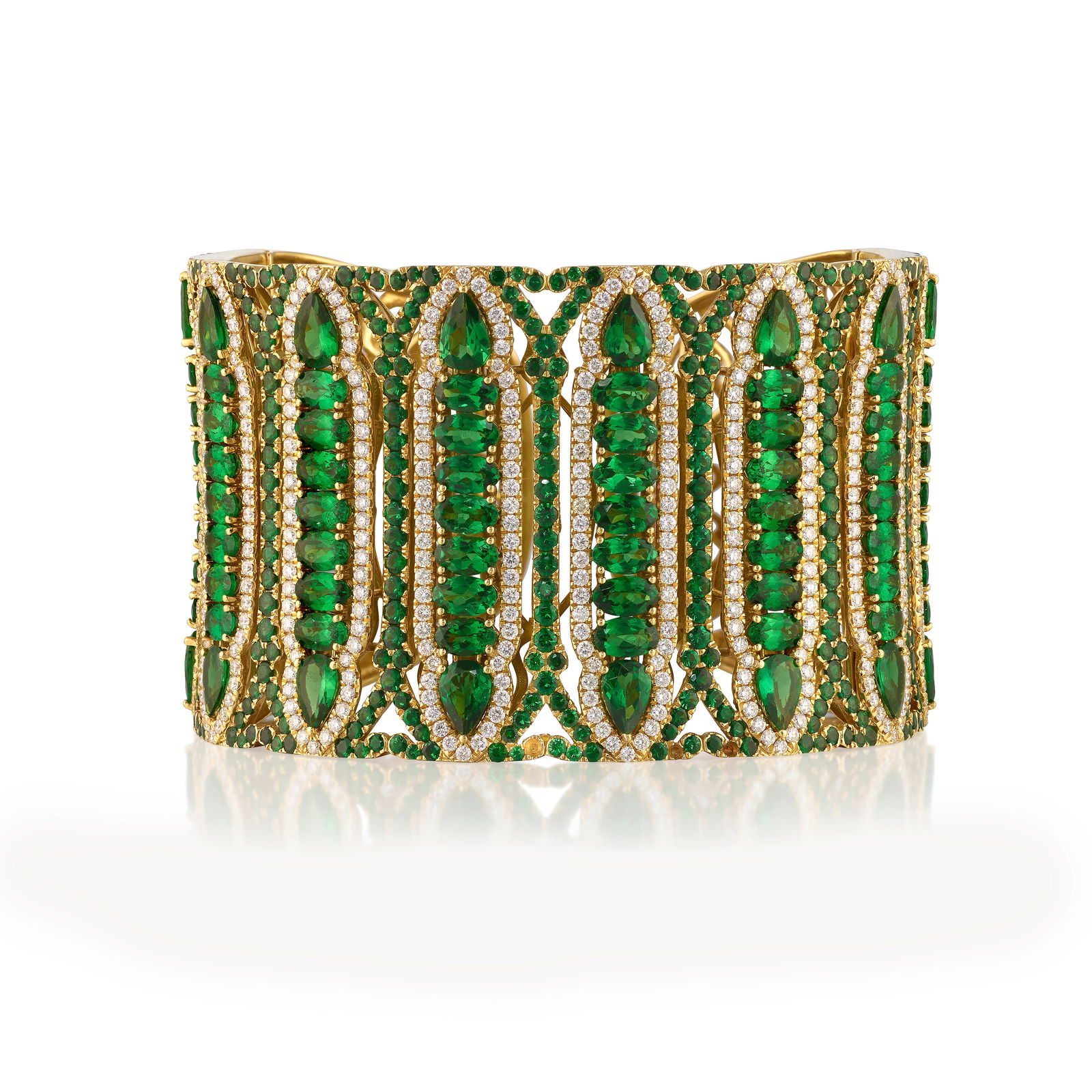 WENDY YUE: AN 18K GOLD, TSAVORITE GARNET AND DIAMOND BRACELET: WENDY YUE: AN 18K GOLD, TSAVORITE GARNET AND DIAMOND BRACELET An openwork cuff, set across with oval, pear-shaped and round brilliant-cut tsavorite garnets, accented with round brilliant-cut diamonds;