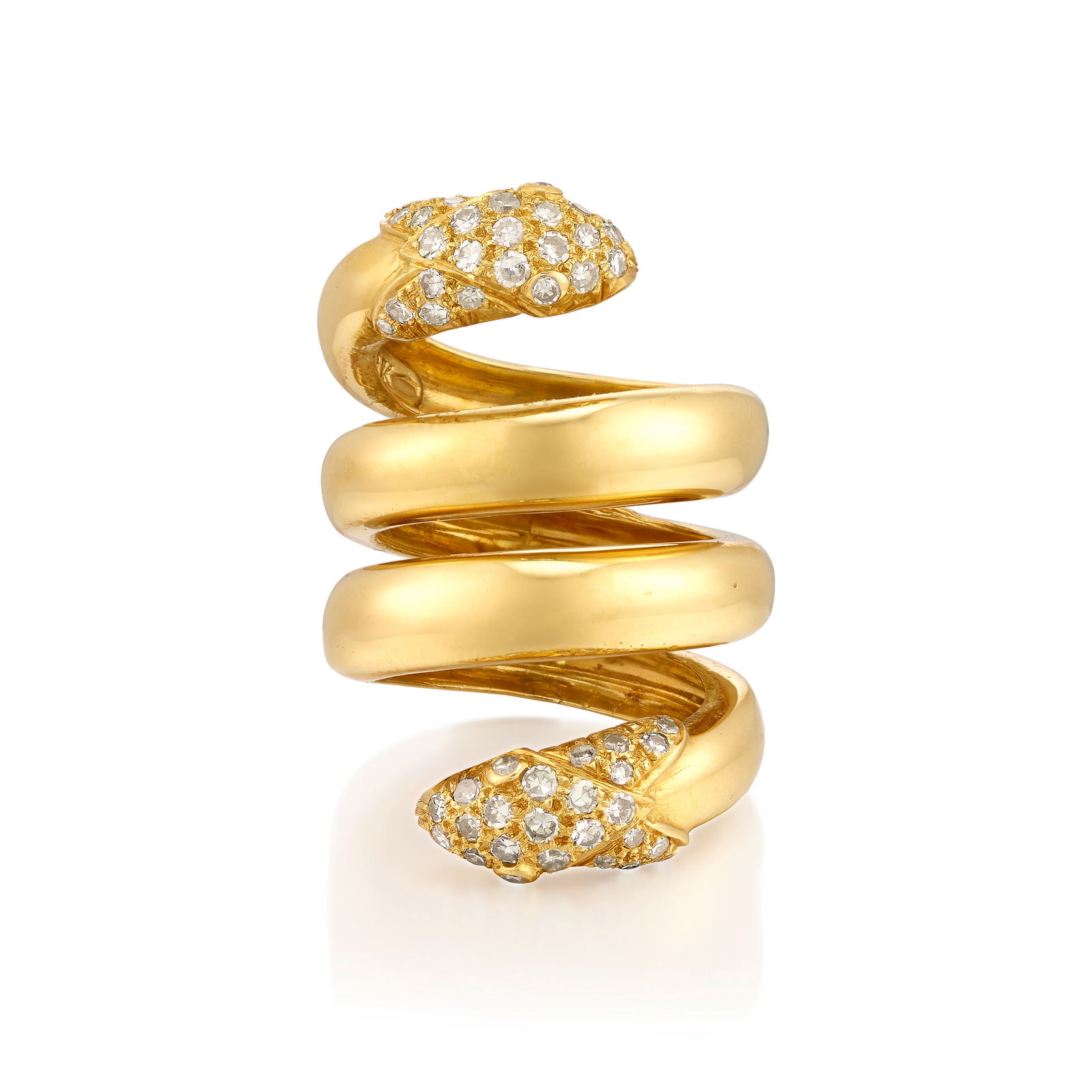 CHRISTIAN DIOR: AN 18K GOLD AND DIAMOND RING: CHRISTIAN DIOR: AN 18K GOLD AND DIAMOND RINGDesigned as a coiling, double-headed snake, each head pavé-set with single-cut diamonds; signed Ch. Dior; partial assay mark; estimated total diamond