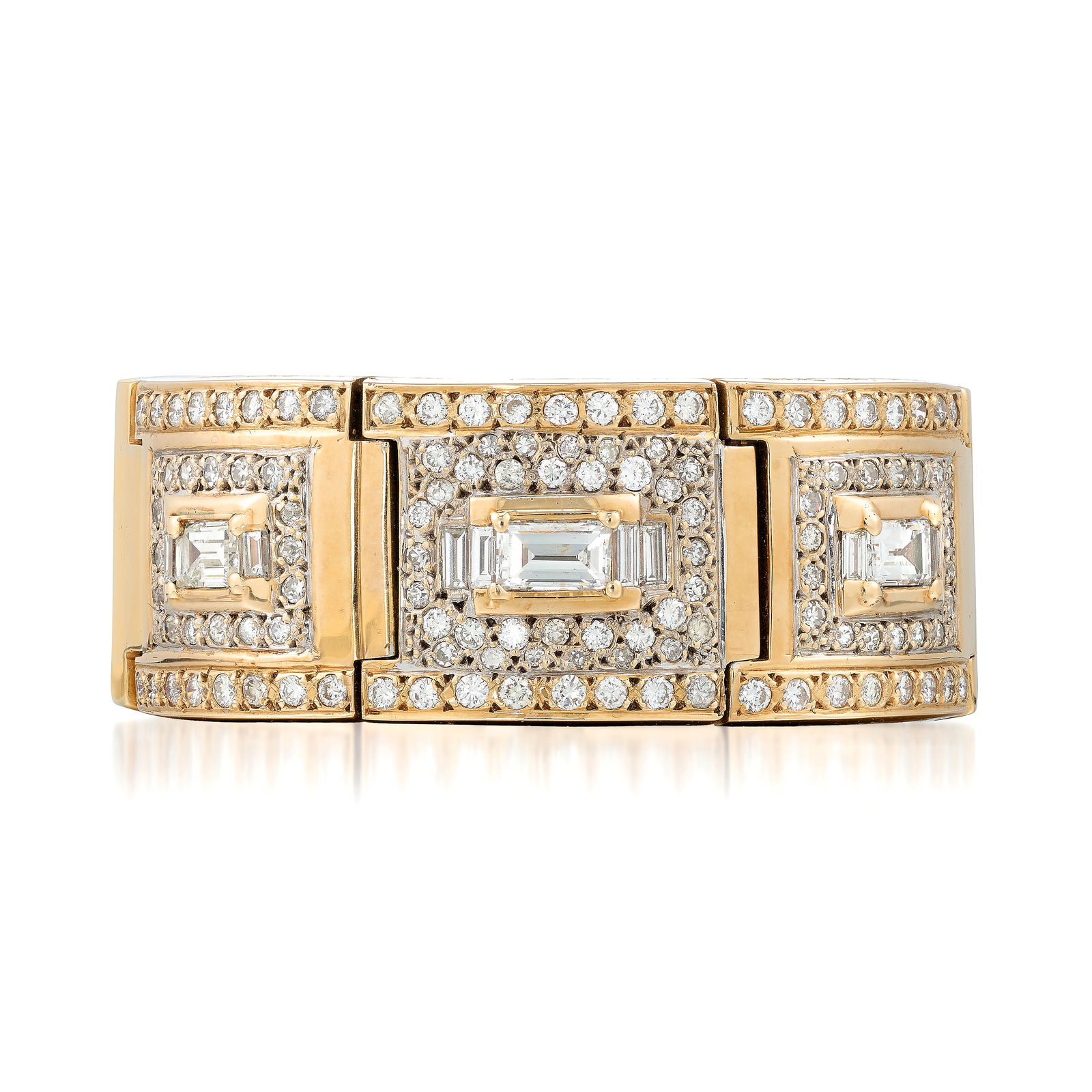 A DIAMOND BRACELET: A DIAMOND BRACELETComposed of square, linked elements, the center three set with emerald-cut diamonds, flanked by baguette-cut diamonds and further surrounded by pavé-set round brilliant and