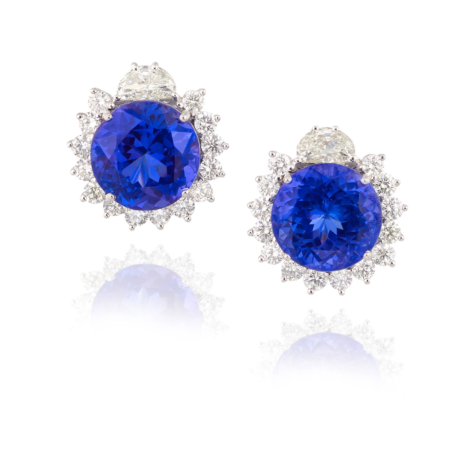 A PAIR OF 18K WHITE GOLD, TANZANITE AND DIAMOND EARRINGS: A PAIR OF 18K WHITE GOLD, TANZANITE AND DIAMOND EARRINGSCentering round brilliant-cut tanzanites, estimated total weight 17.90 carats, in surrounds of round brilliant-cut and half-moon-shaped