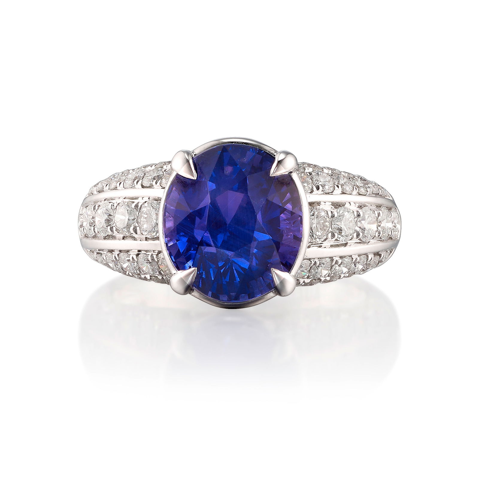 AN 18K WHITE GOLD, COLOR-CHANGE SAPPHIRE AND DIAMOND RING: AN 18K WHITE GOLD, COLOR-CHANGE SAPPHIRE AND DIAMOND RINGCentering an oval-shaped, mixed-cut color-change sapphire, weighing 6.04 carat, accented with round brilliant-cut diamonds; estimated total
