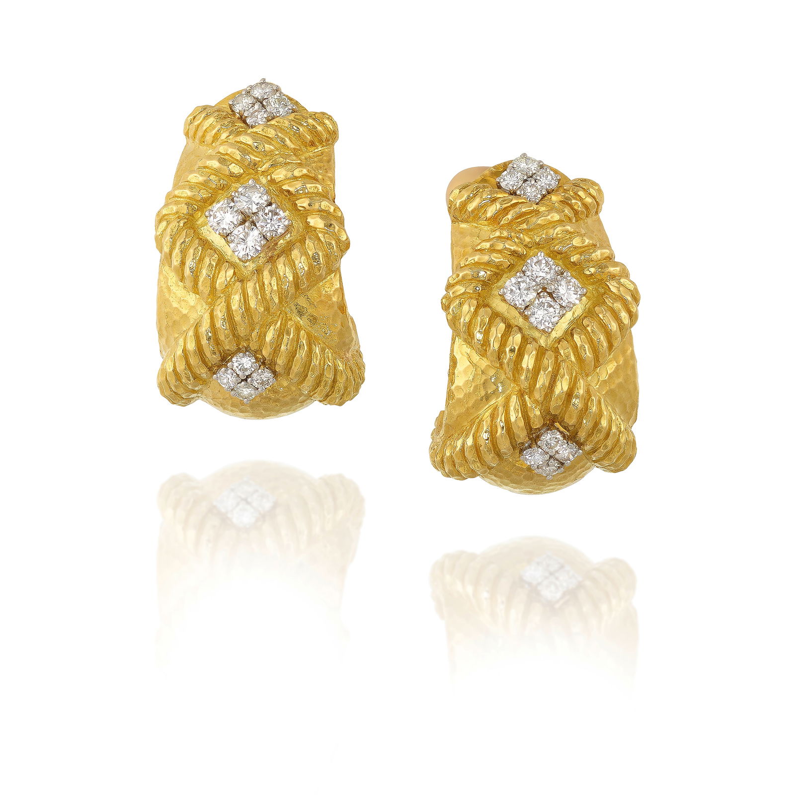 DAVID WEBB: A PAIR OF 18K GOLD, PLATINUM AND DIAMOND EARCLIPS: DAVID WEBB: A PAIR OF 18K GOLD, PLATINUM AND DIAMOND EARCLIPSOf hammered gold, with rope detailing, accented with round brilliant-cut diamonds; signed Webb; estimated total diamond weight 3.35