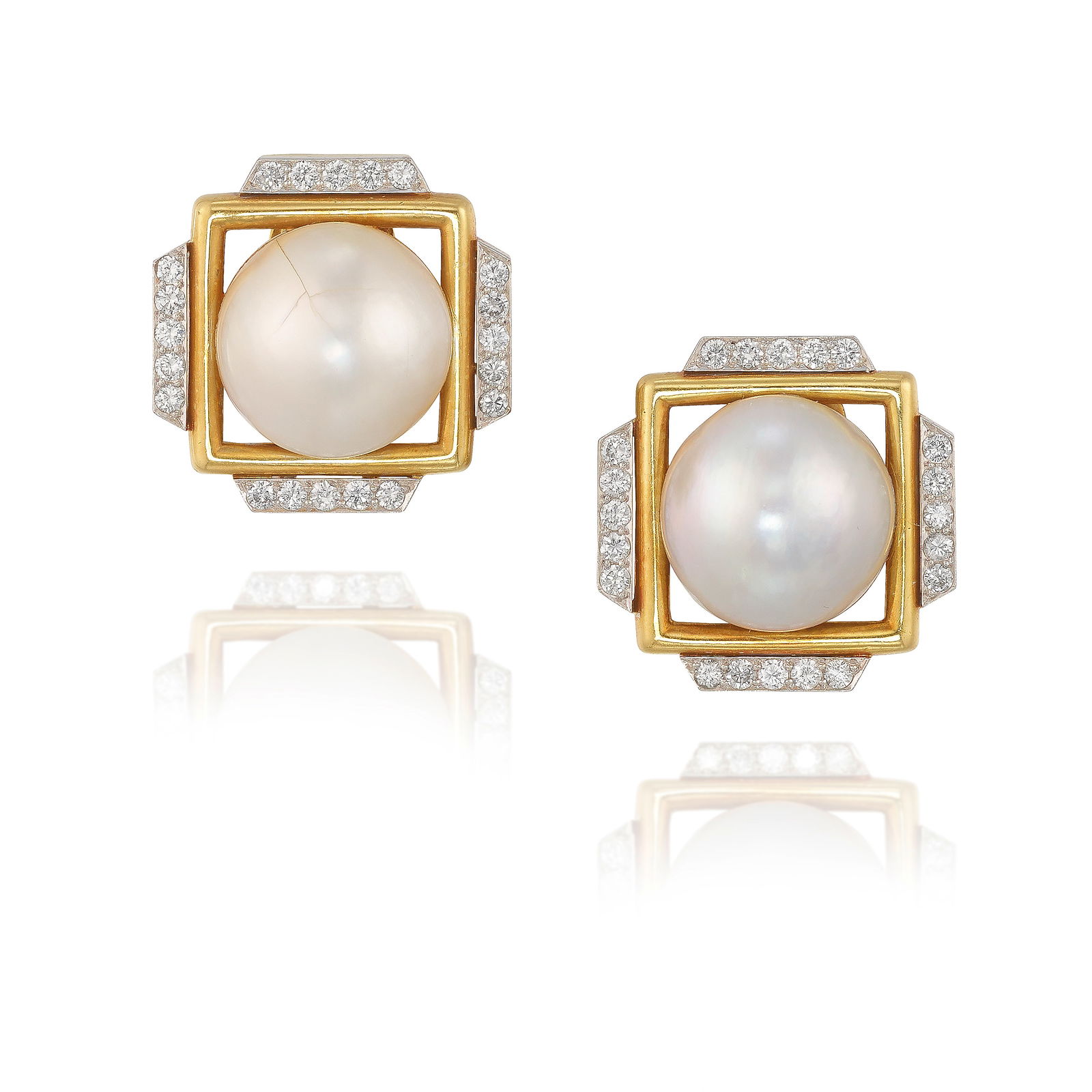 DAVID WEBB: A PAIR OF 18K GOLD, PLATINUM, MABÉ PEARL AND DIAMOND EARCLIPS: DAVID WEBB: A PAIR OF 18K GOLD, PLATINUM, MABÉ PEARL AND DIAMOND EARCLIPSCentering Mabé pearls in frames of gold, accented with round brilliant-cut diamonds; signed Webb; estimated total