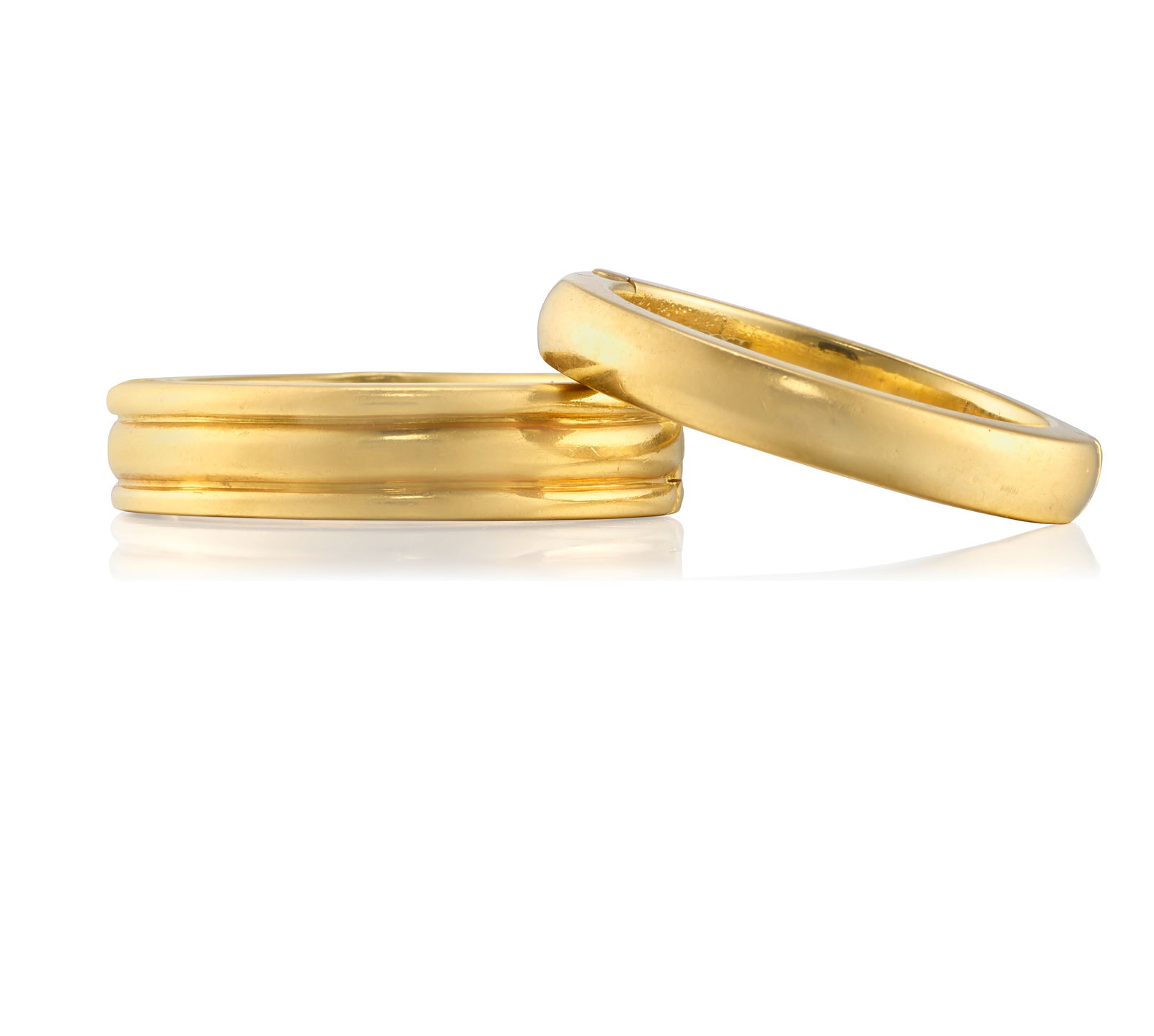 ANDREW CLUNN: A SET OF 18K GOLD RINGS: ANDREW CLUNN: A SET OF 18K GOLD RINGSComprising two gold bands; both signed A. Clunn; both size 8 on mandrelFootnotes:Lots 101 - 127A Private Collection of Jewelry by David Webb and Andrew Clunn