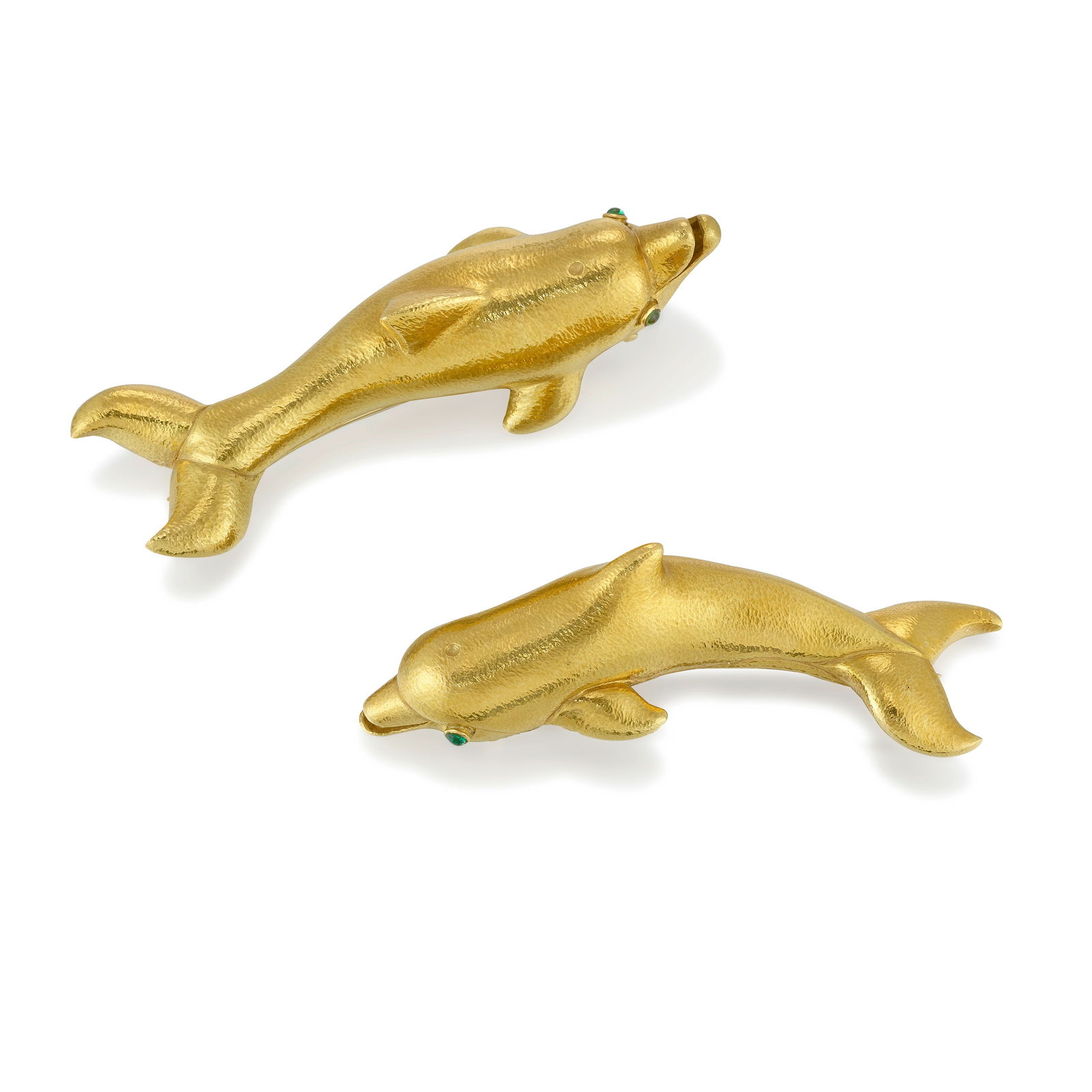 ANDREW CLUNN: A SET OF 18K GOLD AND EMERALD CLIP BROOCHES: ANDREW CLUNN: A SET OF 18K GOLD AND EMERALD CLIP BROOCHES Designed as dolphins, set with round cabochon emerald eyes; each signed A. Clunn; measures 3 5/16 in. and 3 1/2 in. Footnotes: Lots 101 - 127