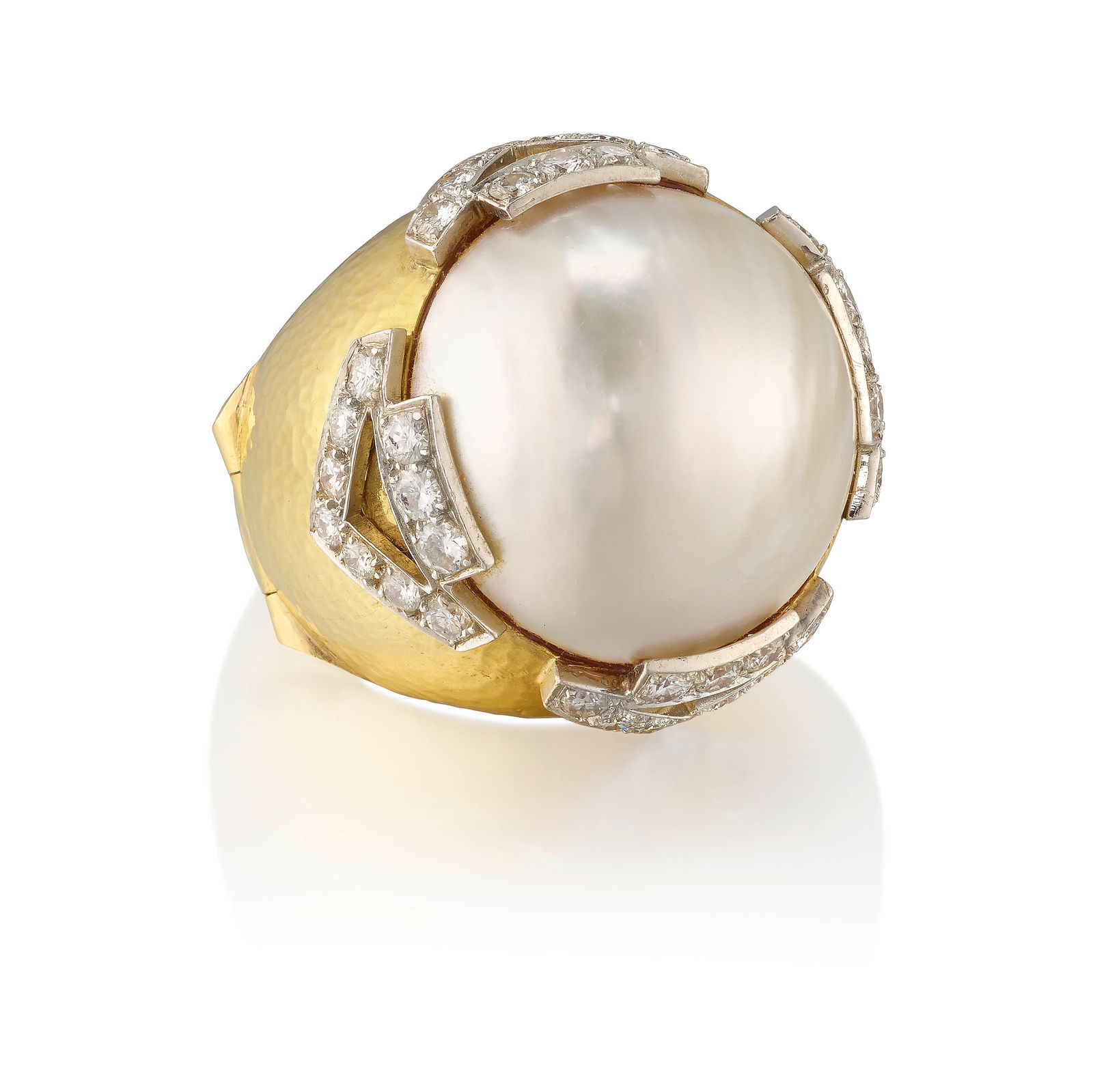 ANDREW CLUNN: AN 18K GOLD, PLATINUM, MABÉ PEARL AND DIAMOND RING: ANDREW CLUNN: AN 18K GOLD, PLATINUM, MABÉ PEARL AND DIAMOND RING Centering a Mabé pearl, accented by round brilliant-cut diamonds; signed A. Clunn; estimated total diamond weight 1.75 carat