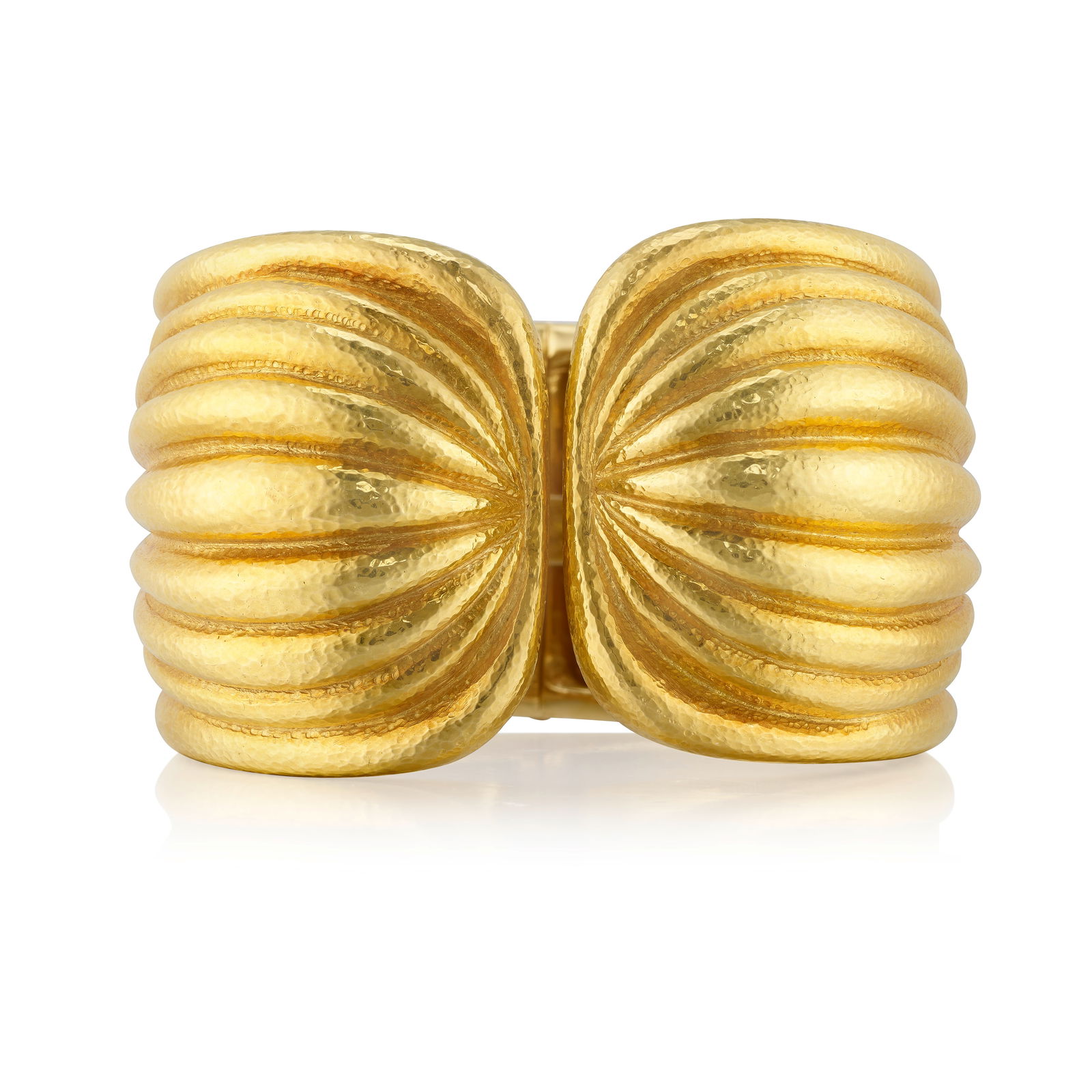 DAVID WEBB: AN 18K GOLD 'SCALLOP' BRACELET: DAVID WEBB: AN 18K GOLD 'SCALLOP' BRACELET A hinged cuff of hammered gold; signed Webb; inner circumference 6 in.; width 1 5/8 in. Footnotes: Lots 101 - 127 A Private Collection of Jewelry by David We